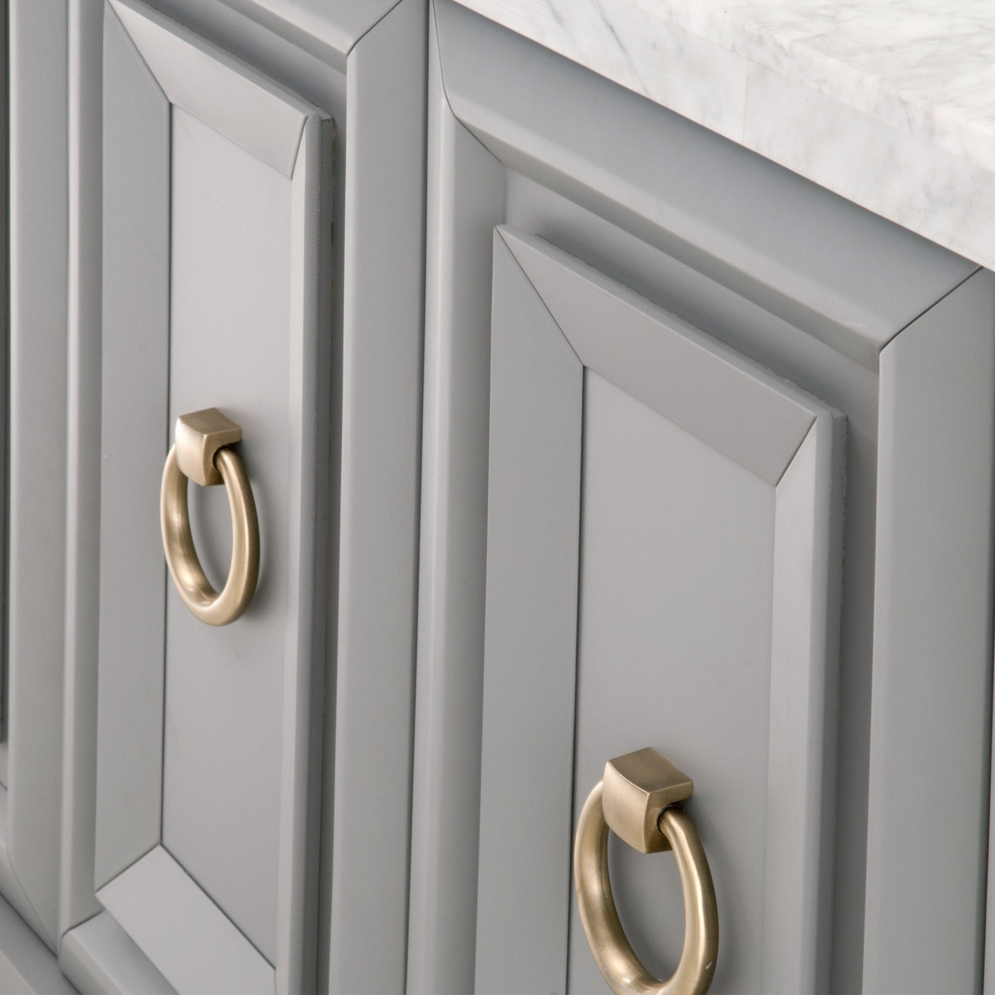 Close-up of Azure Carrera Media Sideboard navy lacquer cabinets with brushed gold ring pulls by Essentials for Living
