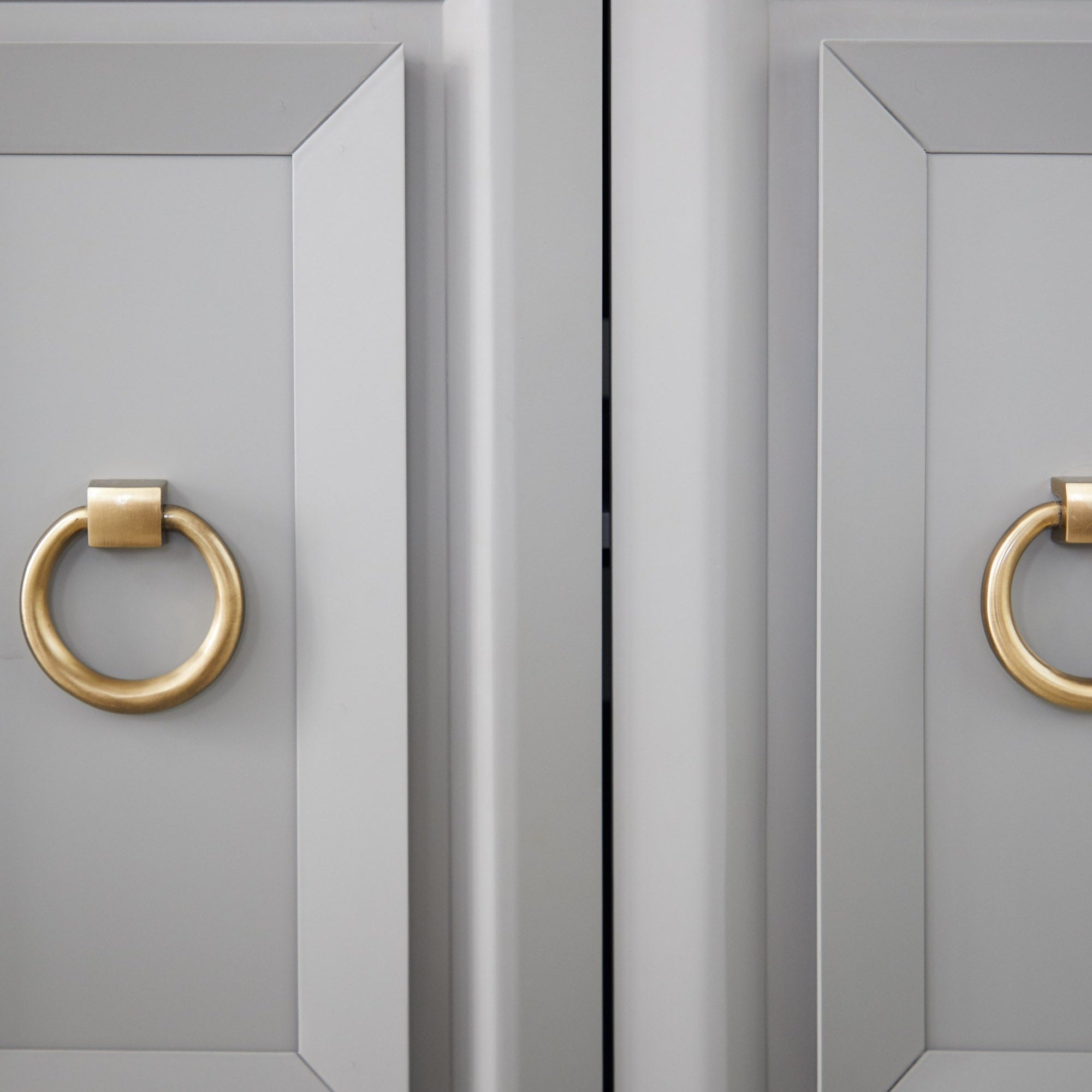 Close-up of brushed gold ring pulls on navy lacquered Azure Carrera Media Sideboard by Essentials for Living