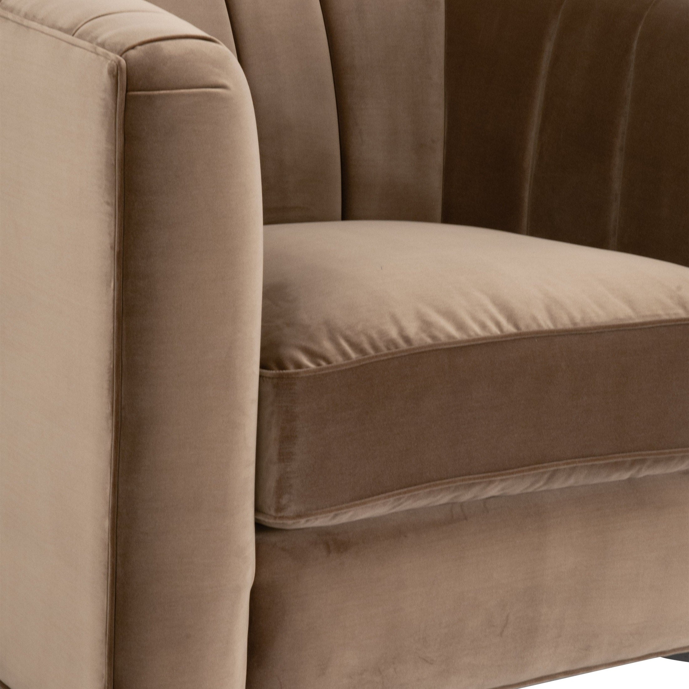Close-up of Bronx Channel Back Sofa Chair in caramel velvet with curved vertical channels and oak feet by Essentials for Living
