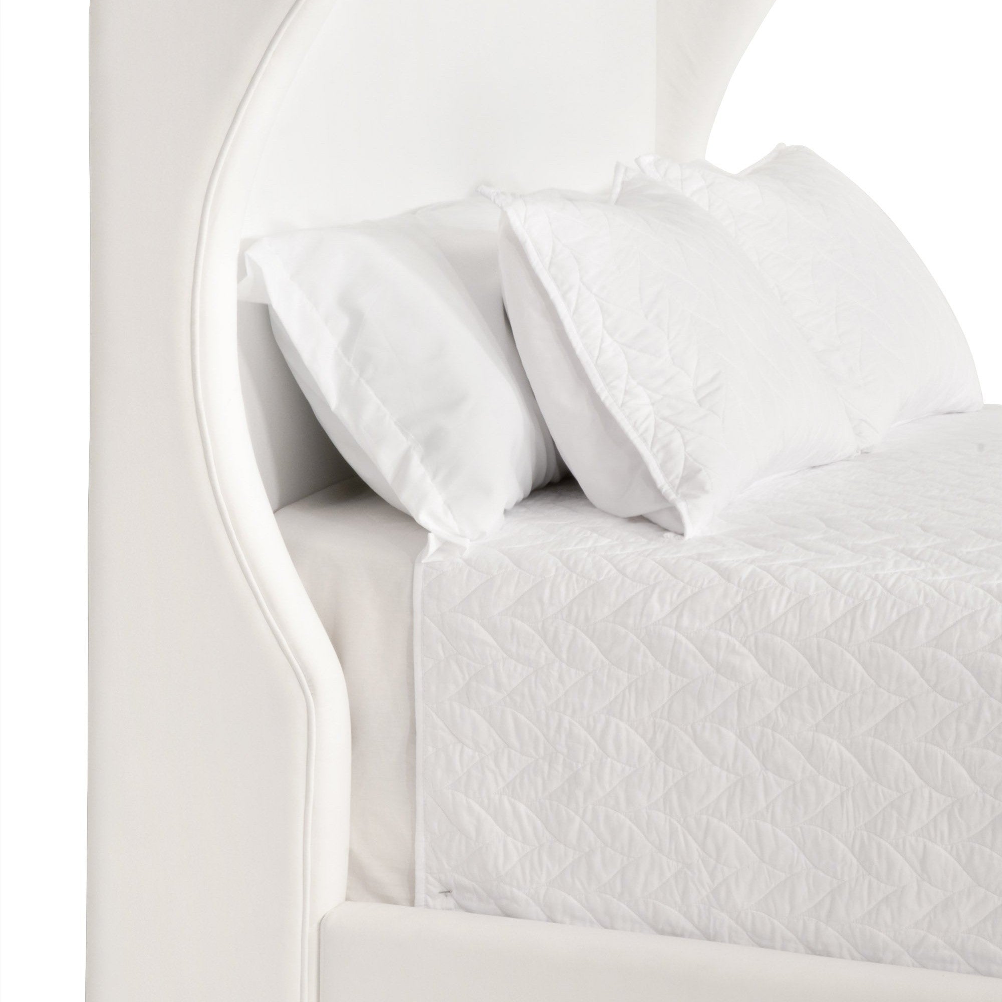 Close-up of Balboa Queen Bed curved wingback headboard in Peyton Pearl fabric by Essentials for Living