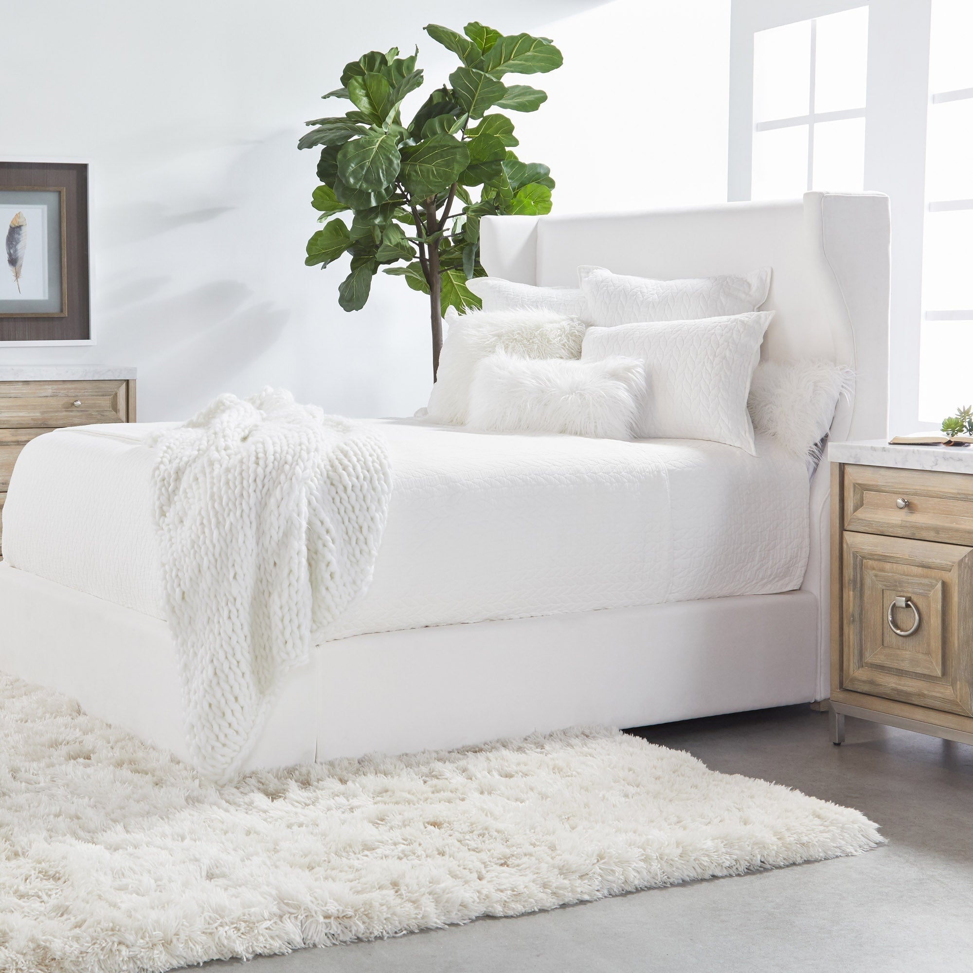 Balboa Queen Bed with upholstered wingback headboard and white bedding in modern bedroom by Essentials for Living