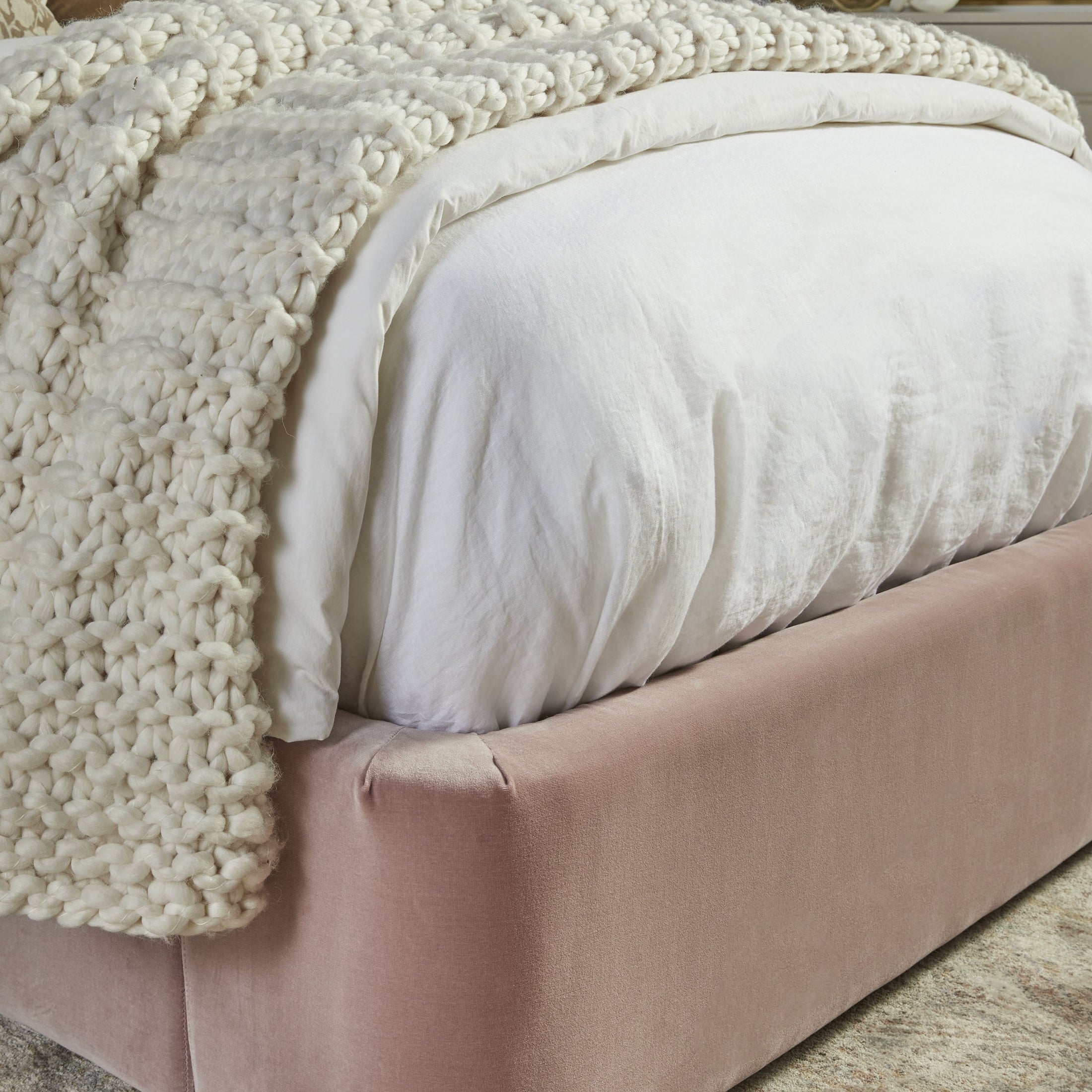 Close-up of Balboa Twin Bed upholstered in soft Petal Velvet with natural gray oak frame by Essentials for Living.