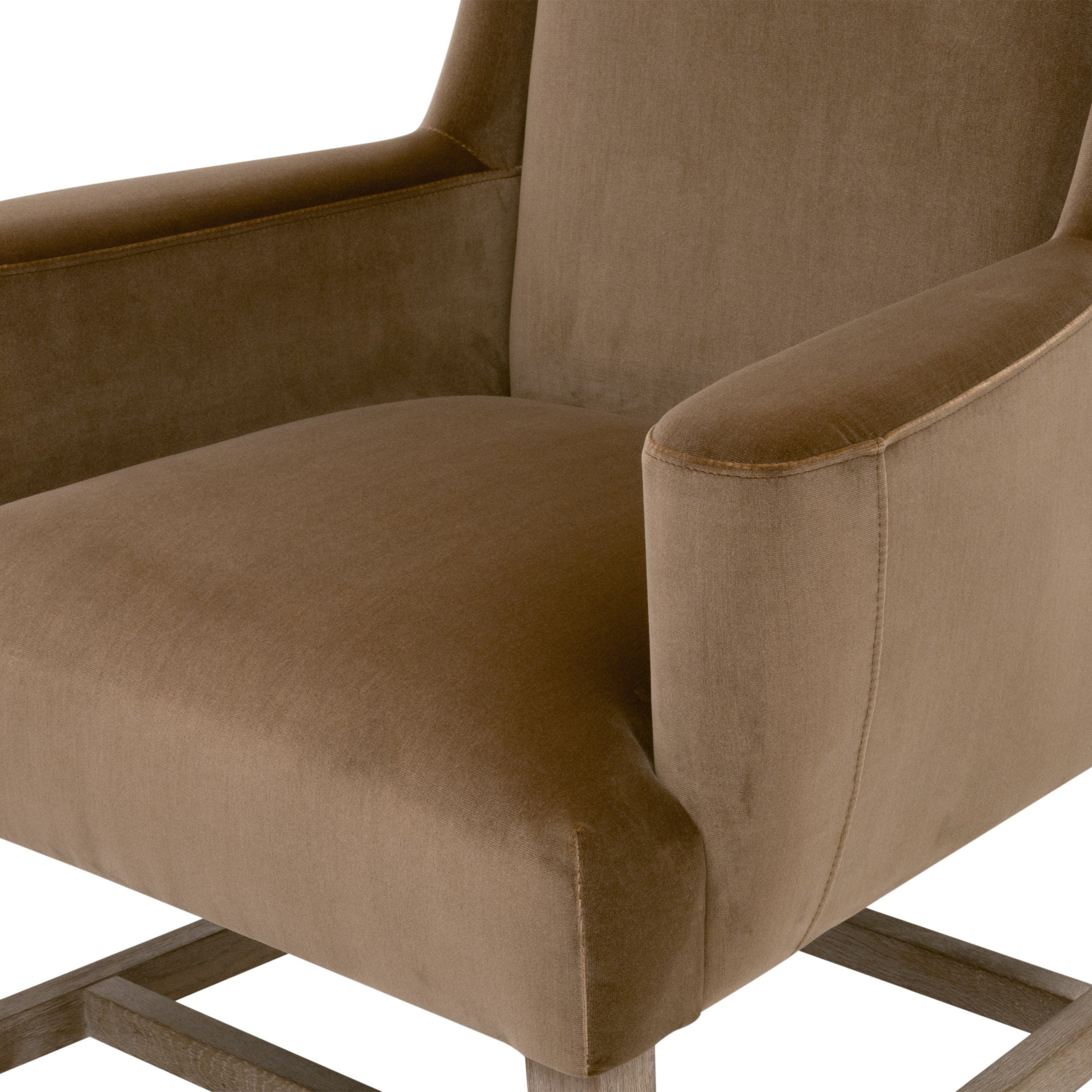 Close-up of the dark caramel velvet Bennett Arm Chair with oak legs by Essentials for Living.
