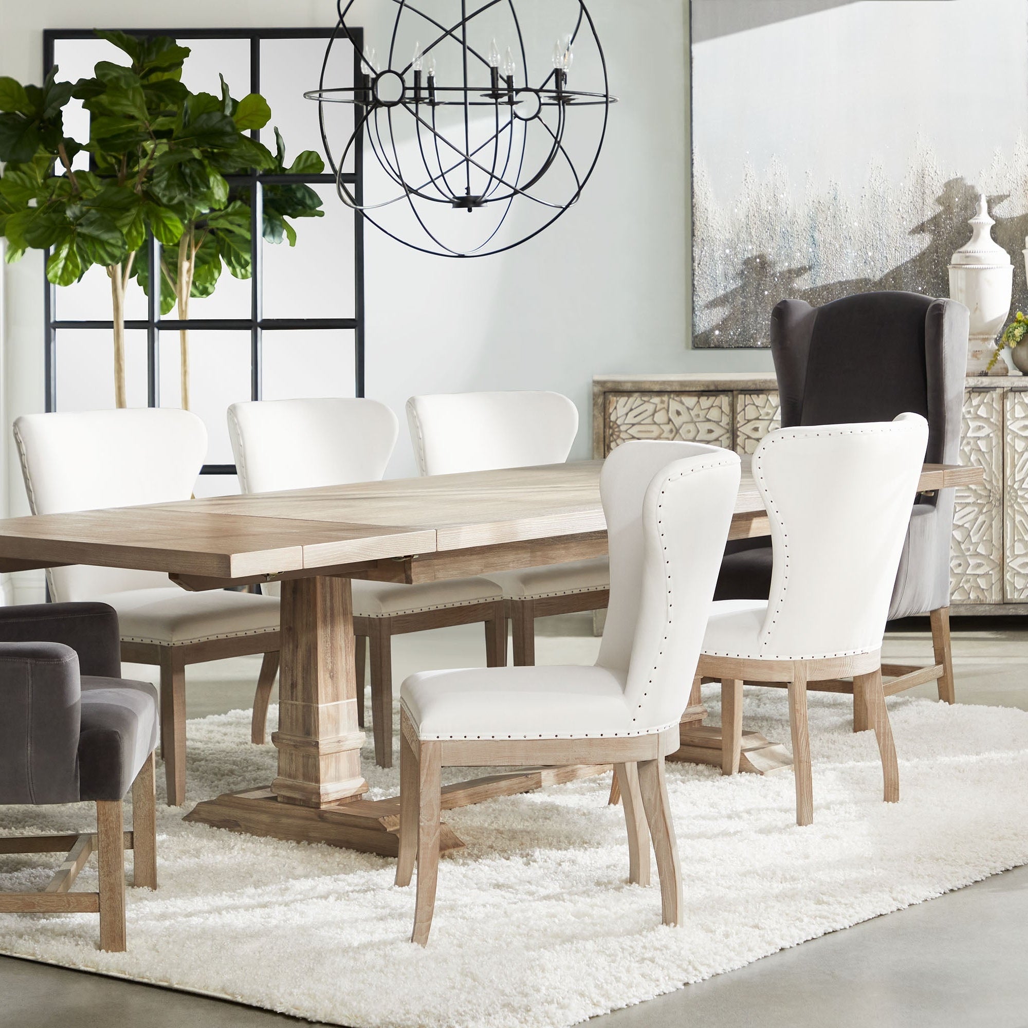 Bennett Arm Chair in dark caramel velvet with gray oak legs, sculptural wingback design by Essentials for Living
