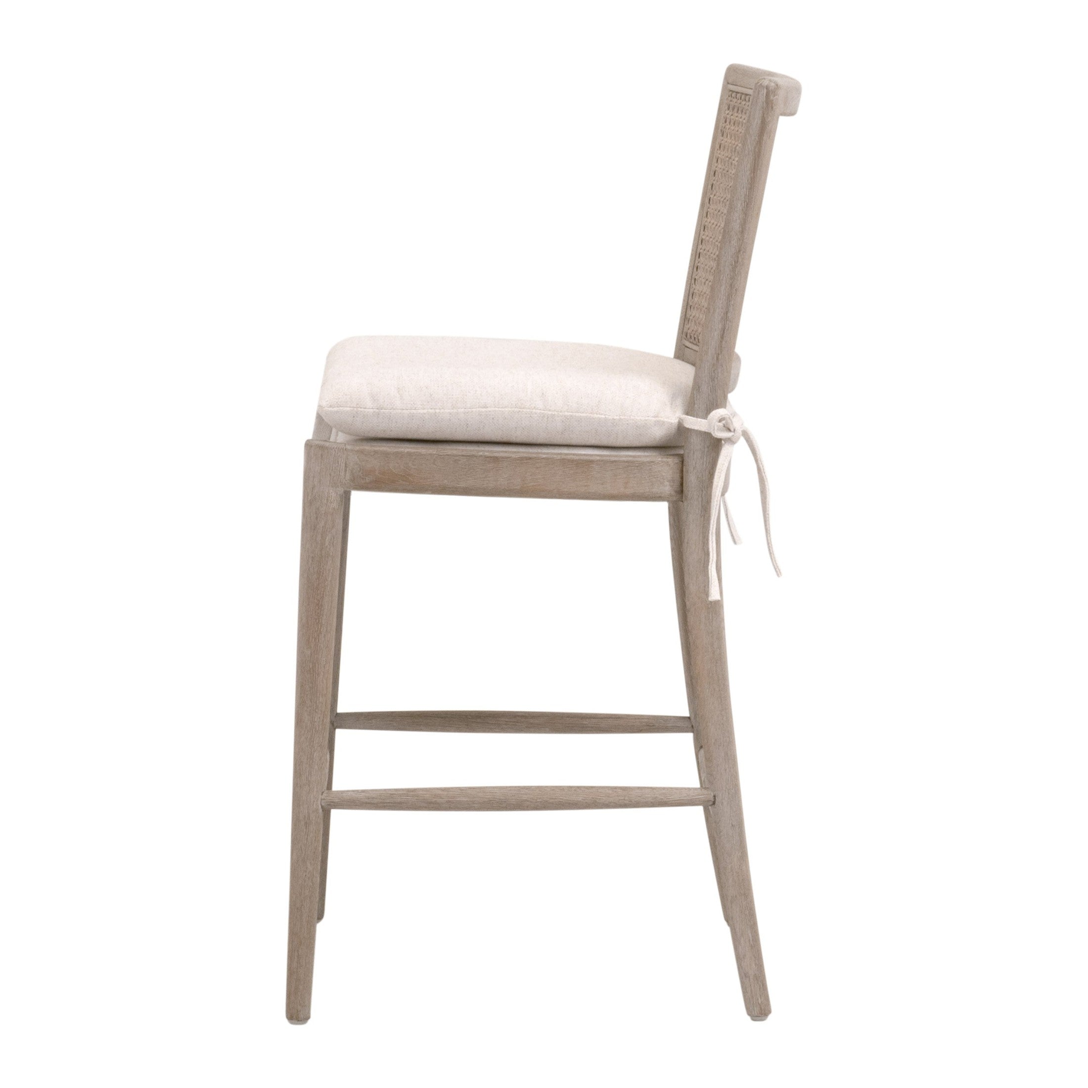 Blume Counter Stool with natural gray oak frame, handwoven cane back, cream linen cushion by Your Noble Nest