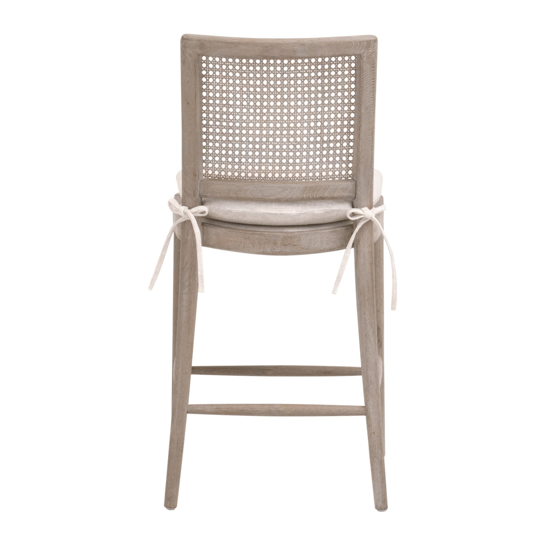 Blume Counter Stool with natural gray oak frame, cane back, cream linen seat, and removable cushion ties by Your Noble Nest