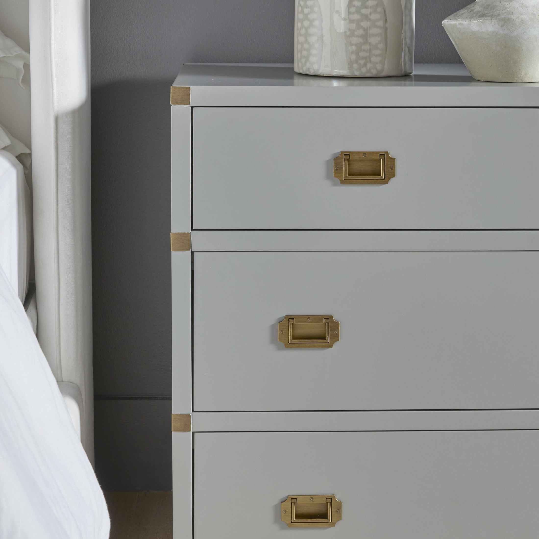 Close-up of dove gray Bradley 7-Drawer Double Dresser with brushed gold hardware by Essentials for Living.