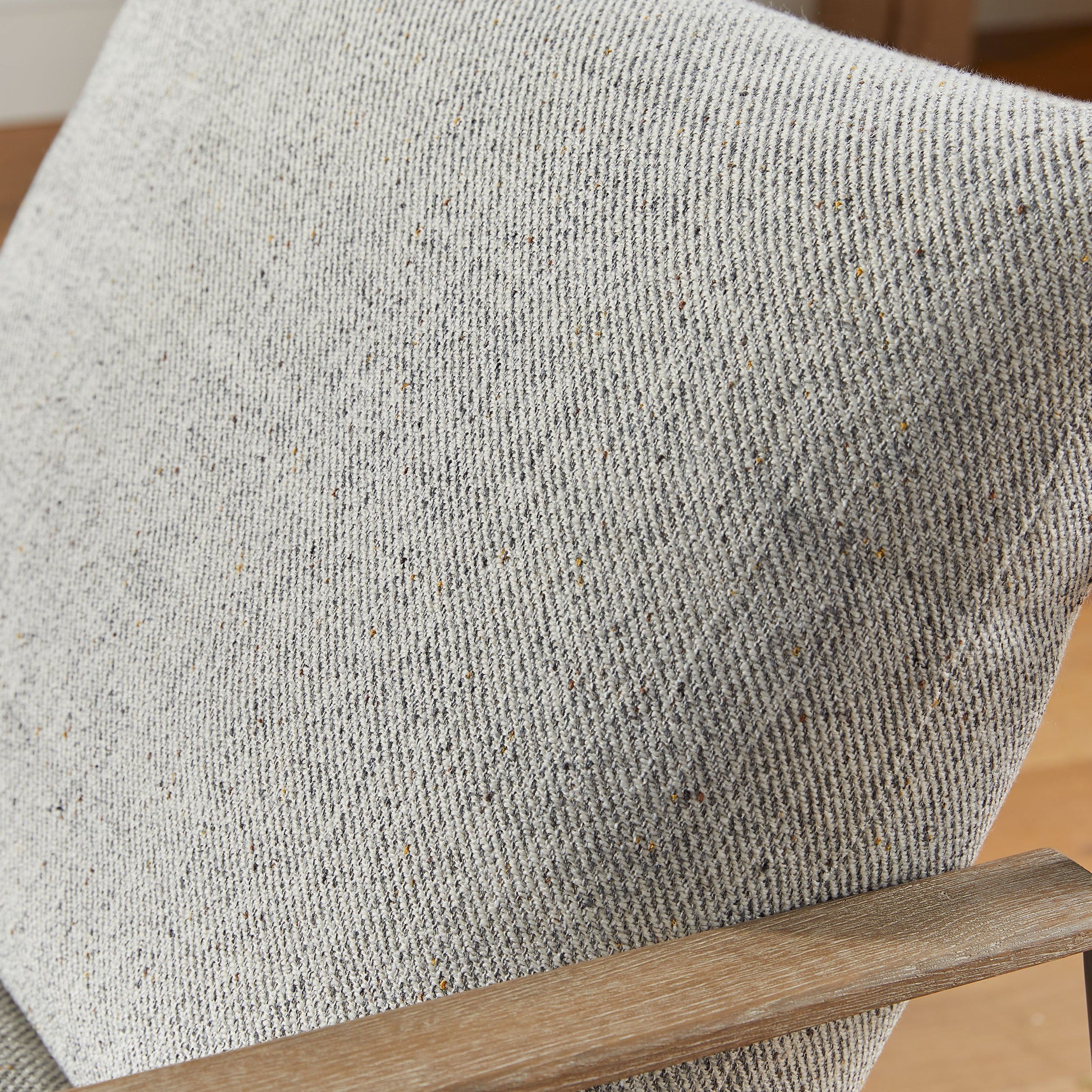 Close-up of LiveSmart Peyton-Pearl fabric cushion on Brando Club Chair by Essentials for Living