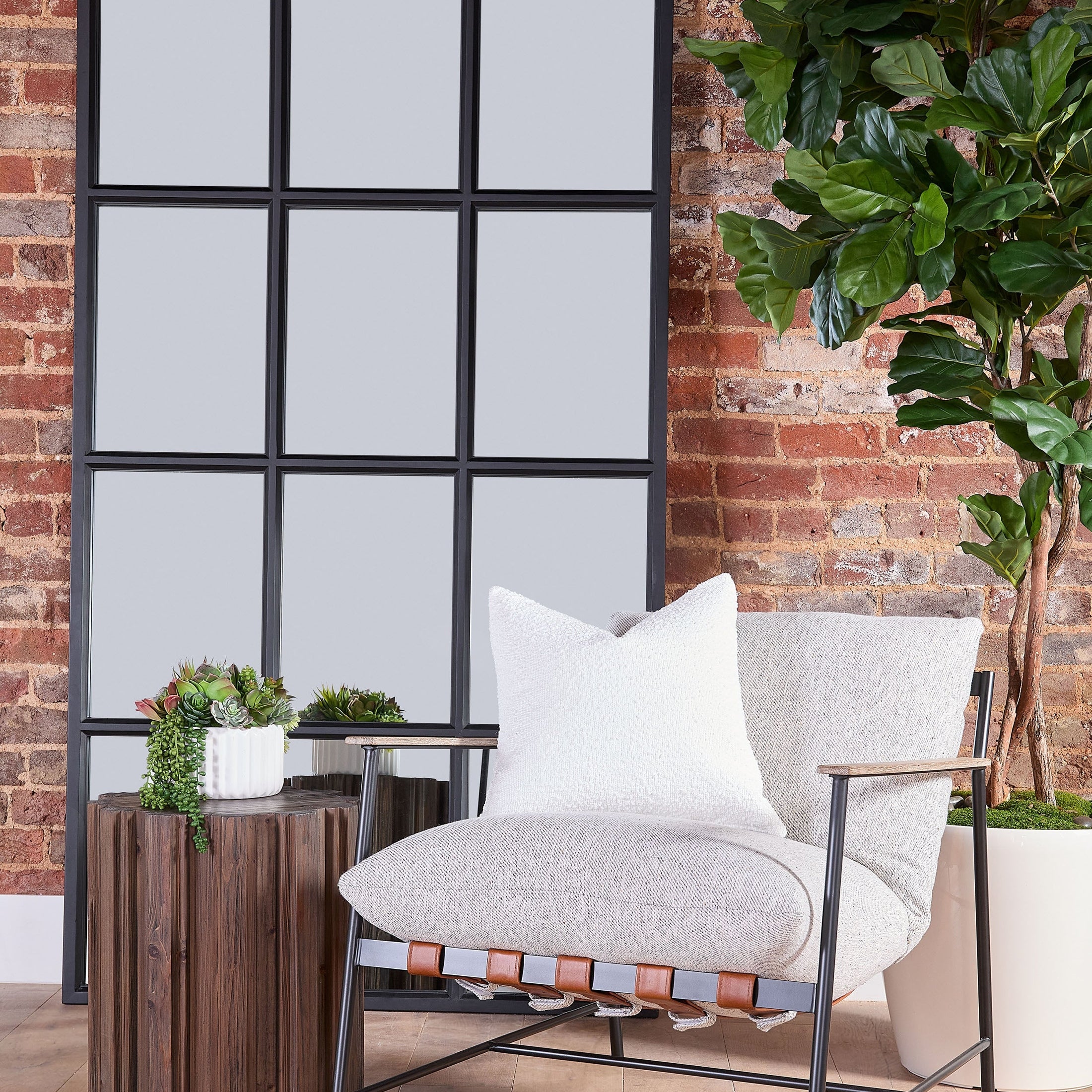 Brando Club Chair with black iron frame, gray oak armrests, and cushioned seat in modern living space by Essentials For Living