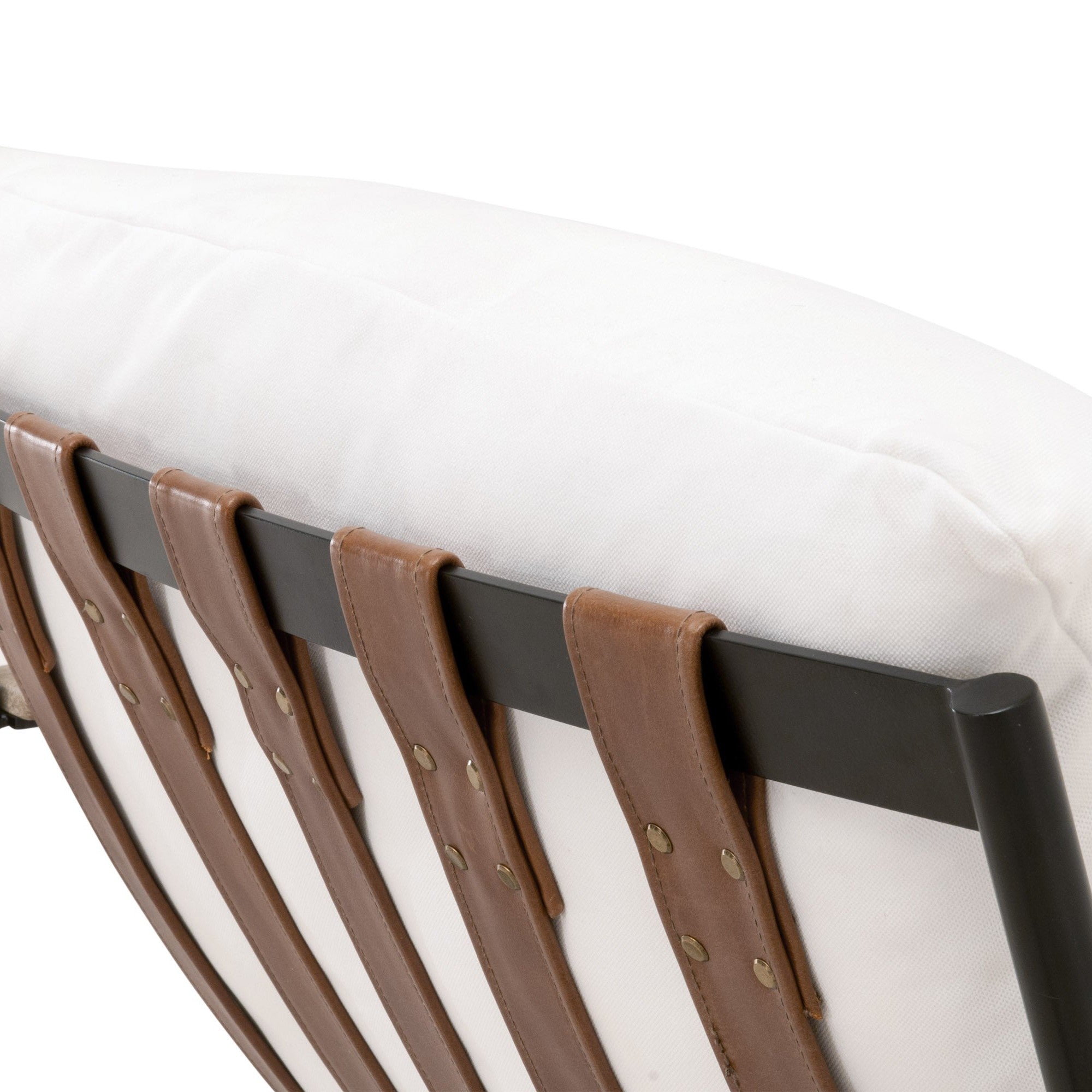 Close-up of Brando Club Chair’s chestnut leather straps and black iron frame with white cushion by Essentials for Living