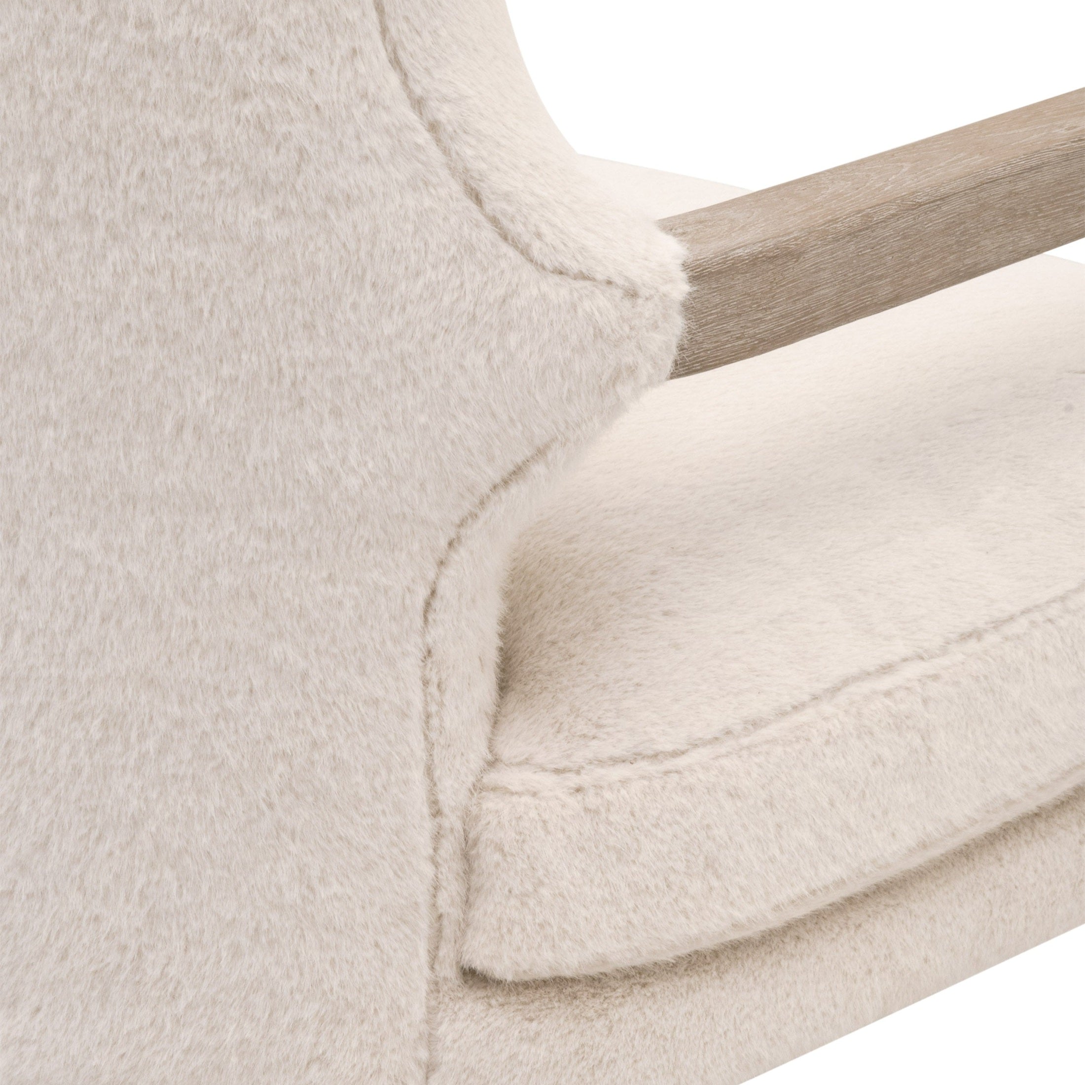 Close-up of beige textured fabric and natural wood arm on the Calvin Club Chair by Essentials for Living