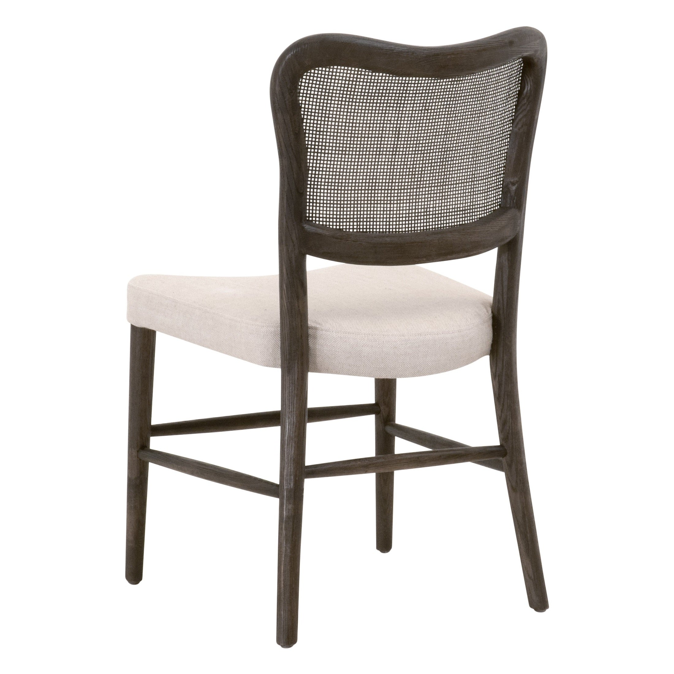 Rustic dining chair with solid oak frame, handwoven cane back, and bisque upholstered seat by Essentials For Living