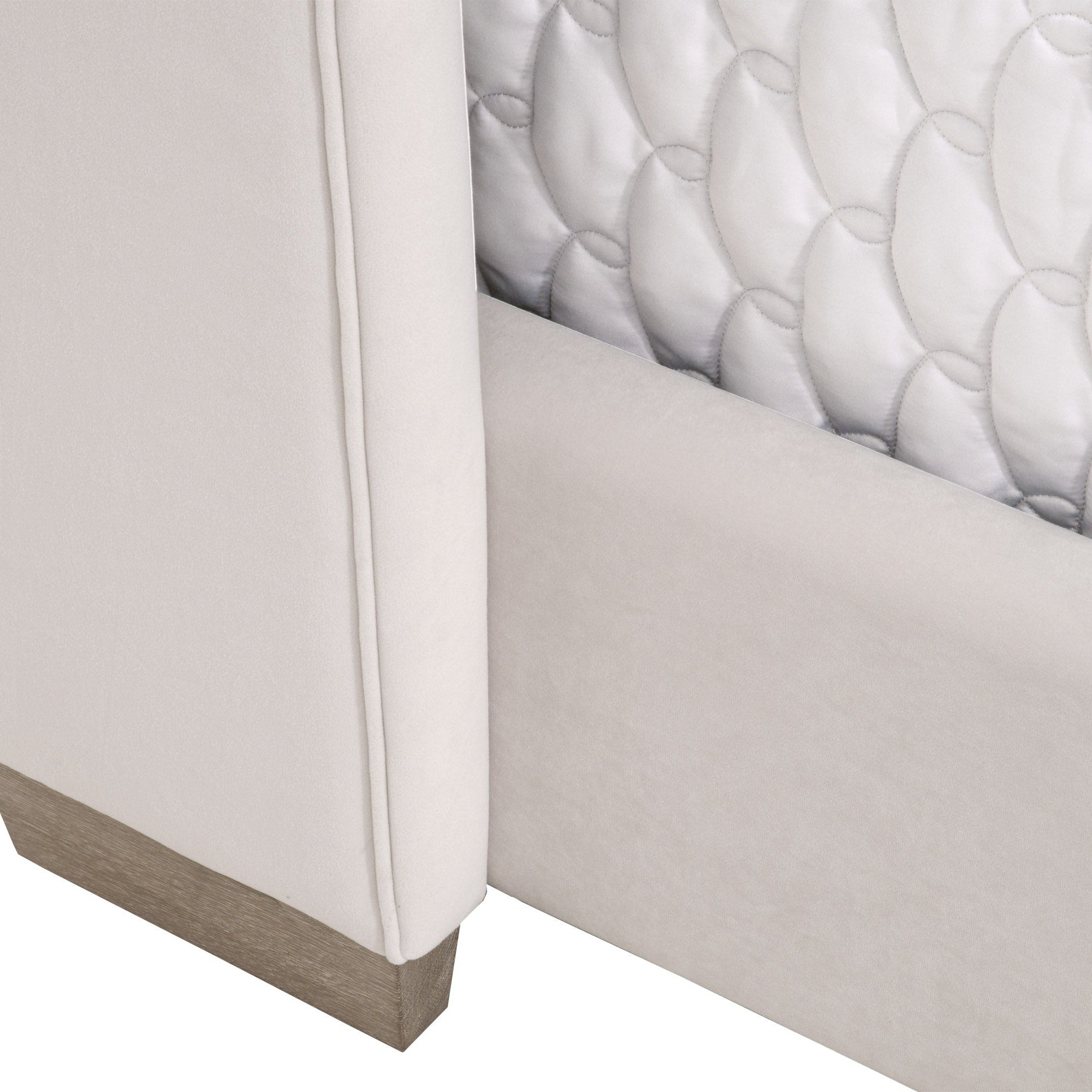 Close-up of Chandler Standard King Bed corner showing cream velvet upholstery and natural gray solid oak leg by Essentials For Living