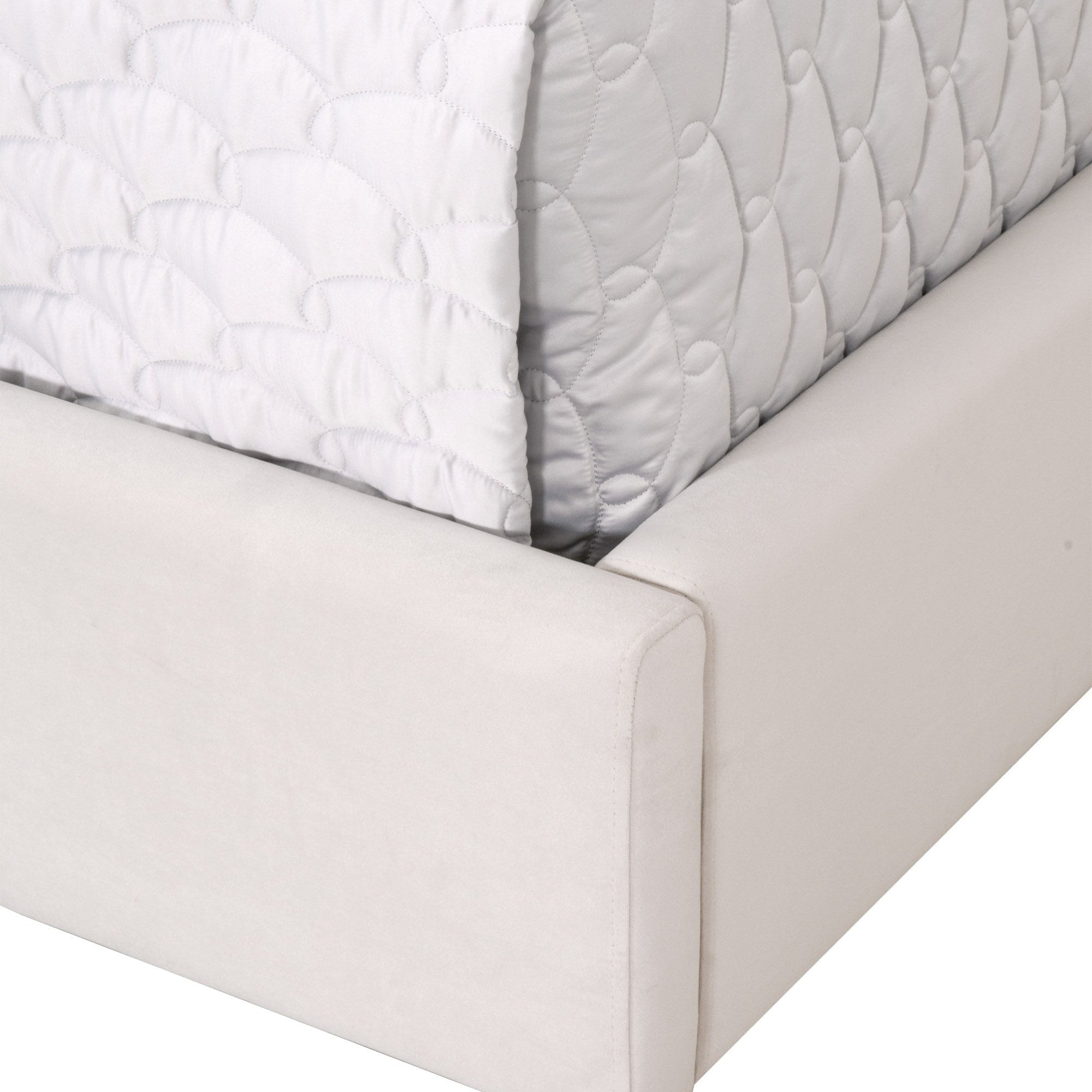 Close-up of the cream velvet upholstered frame base of the Essentials For Living Chandler Standard King Bed