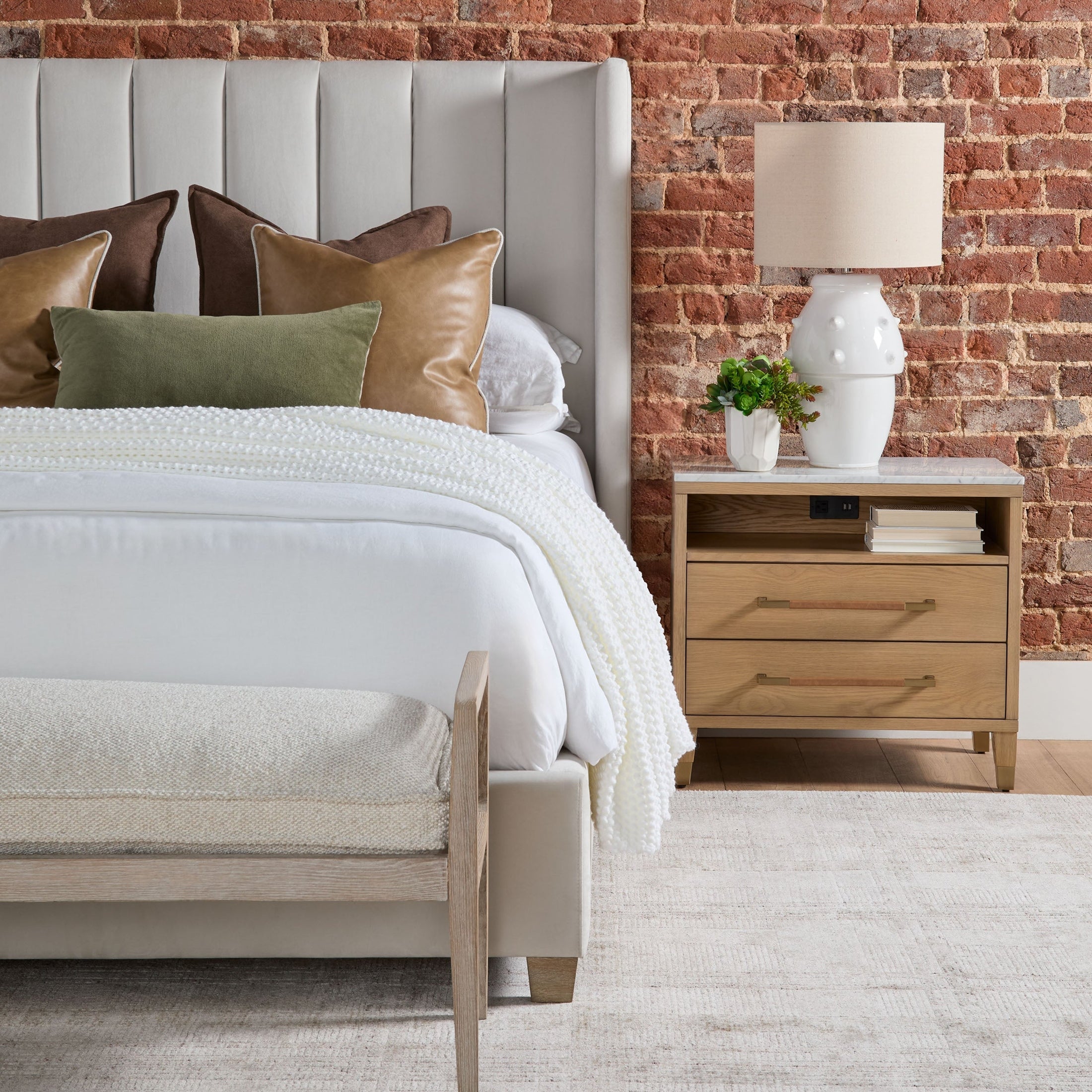 Chandler Standard King Bed upholstered in cream velvet with vertical channel headboard and oak legs by Essentials For Living