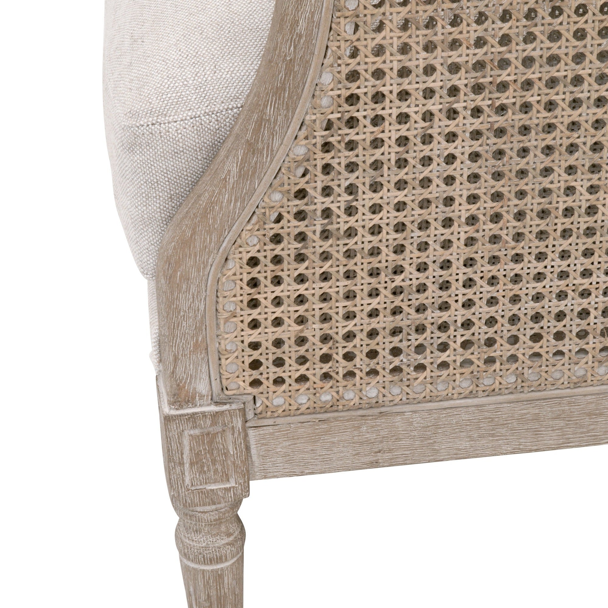 Close-up of Churchill Club Chair’s natural gray oak frame and vintage rattan cane detailing by Essentials For Living