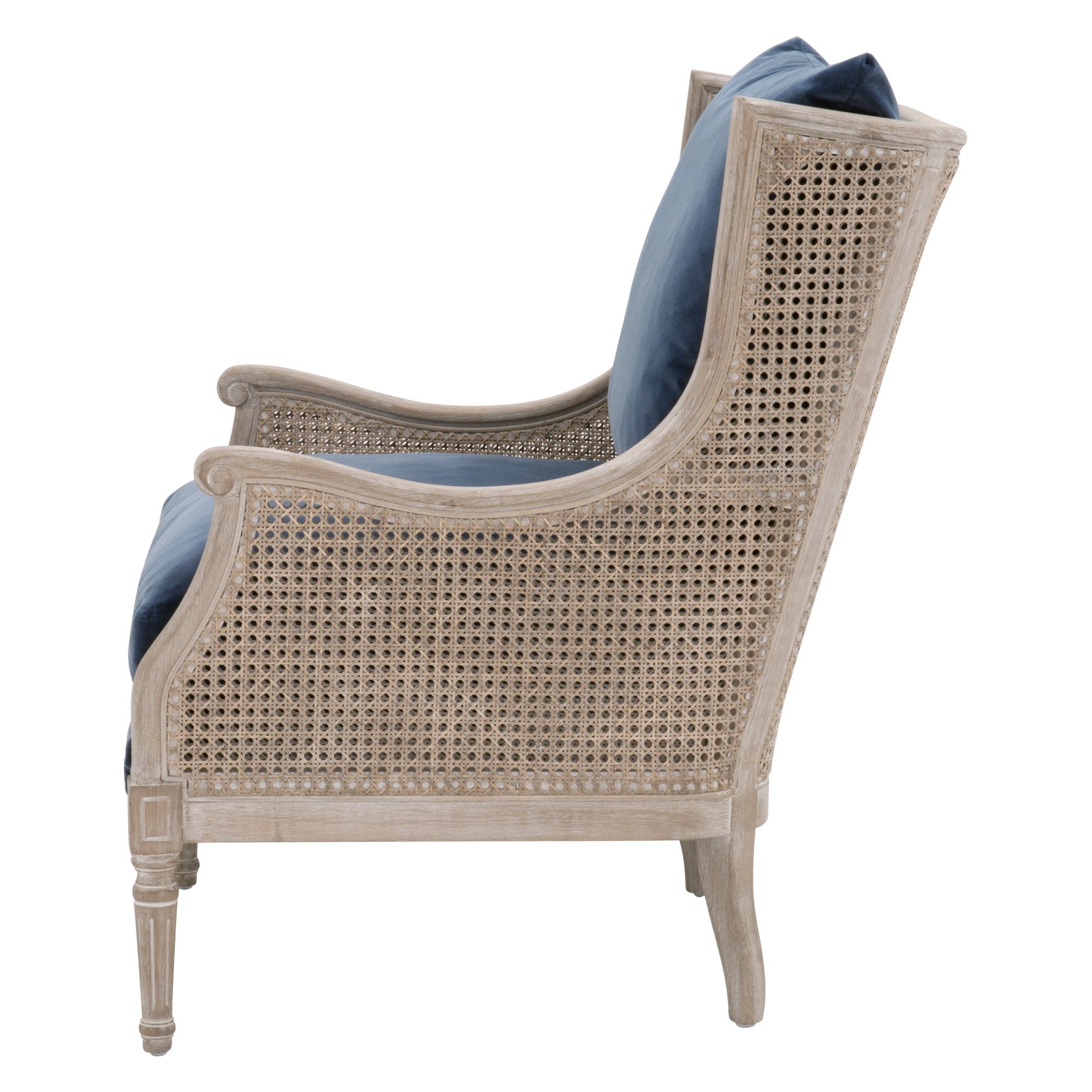 Side view of Churchill Club Chair with natural gray oak frame, rattan cane sides, and blue cushions by Essentials for Living
