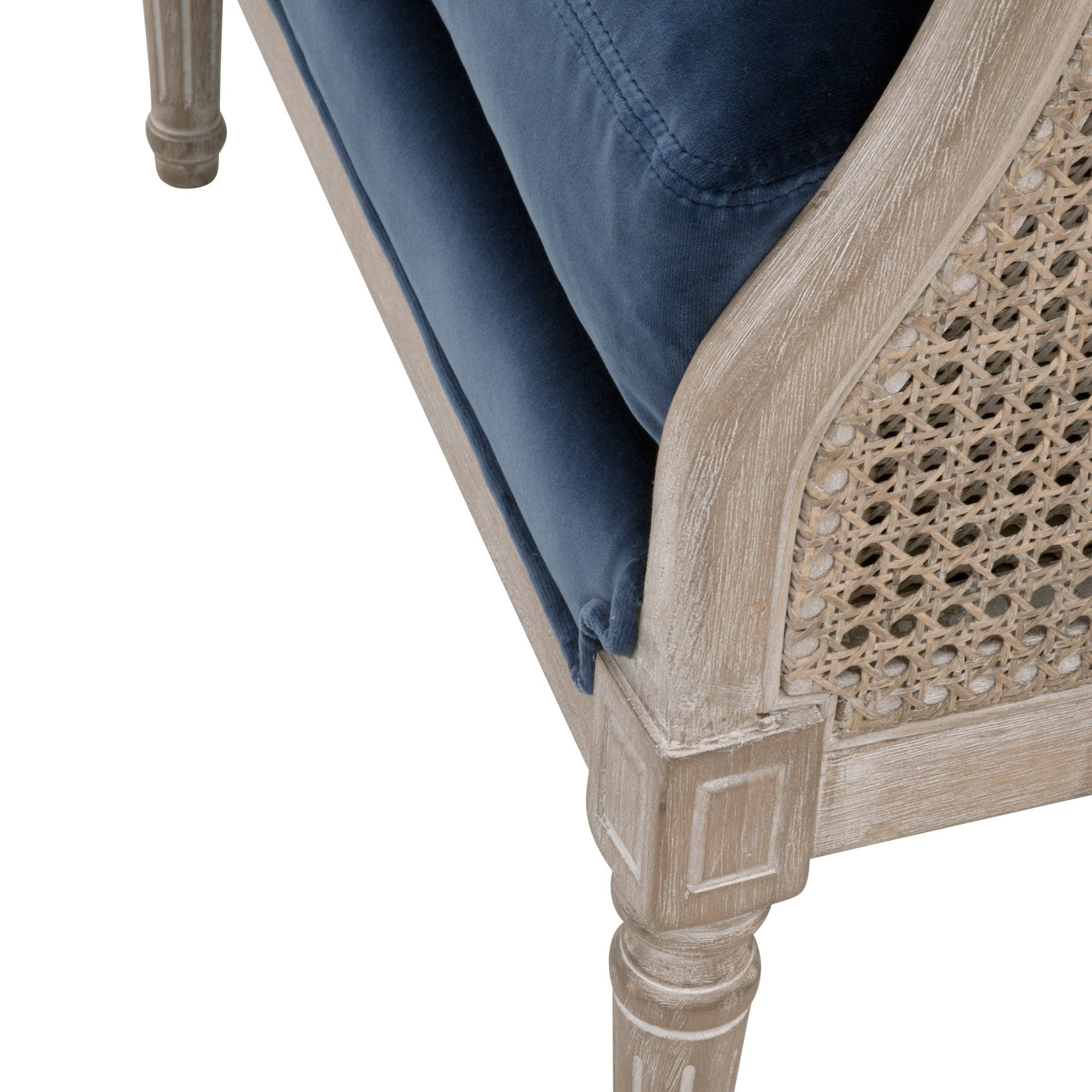 Close-up of natural gray oak frame and rattan cane side with navy blue linen-blend cushion on Churchill Club Chair.