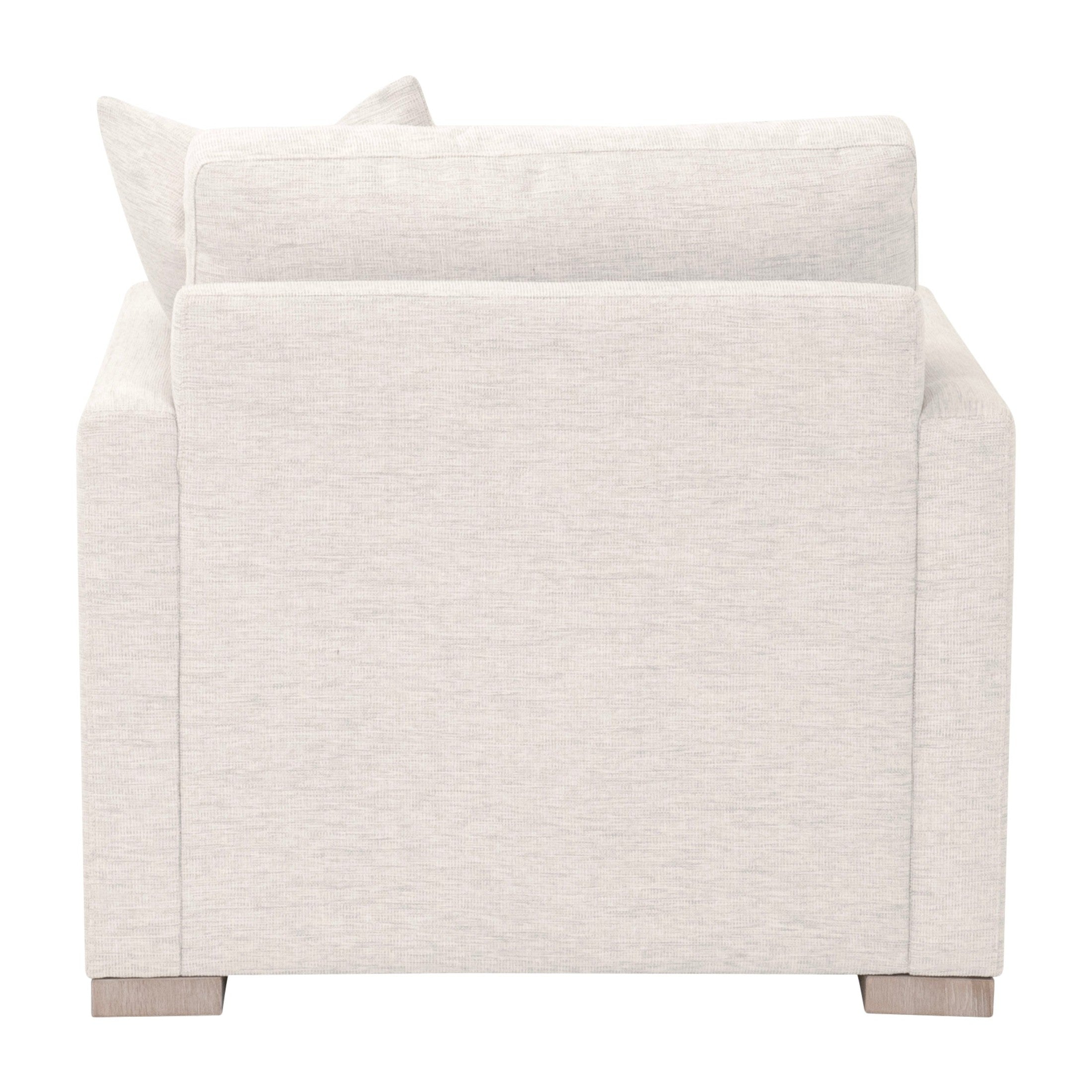 Back view of Clara Slim Arm Sofa Chair in light gray fabric with solid oak feet by Essentials For Living