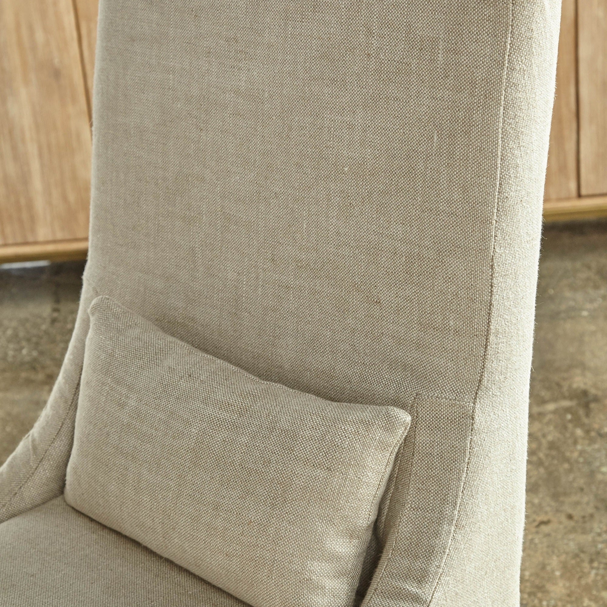 Close-up of creamy bisque linen slipcover dining chair with removable lumbar pillow by Essentials For Living