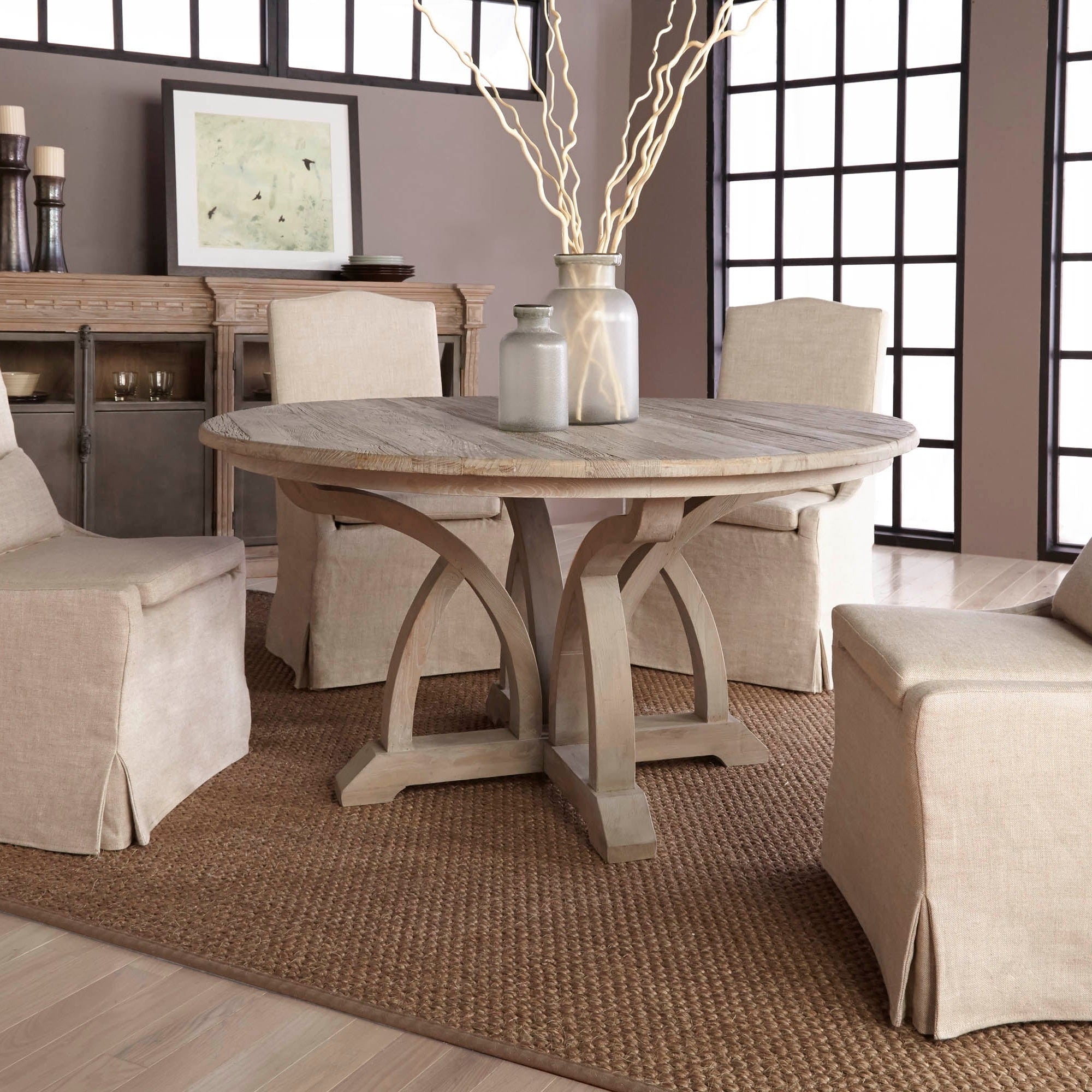 Essentials for Living Colette slipcover dining chairs in creamy bisque linen around rustic round wooden table