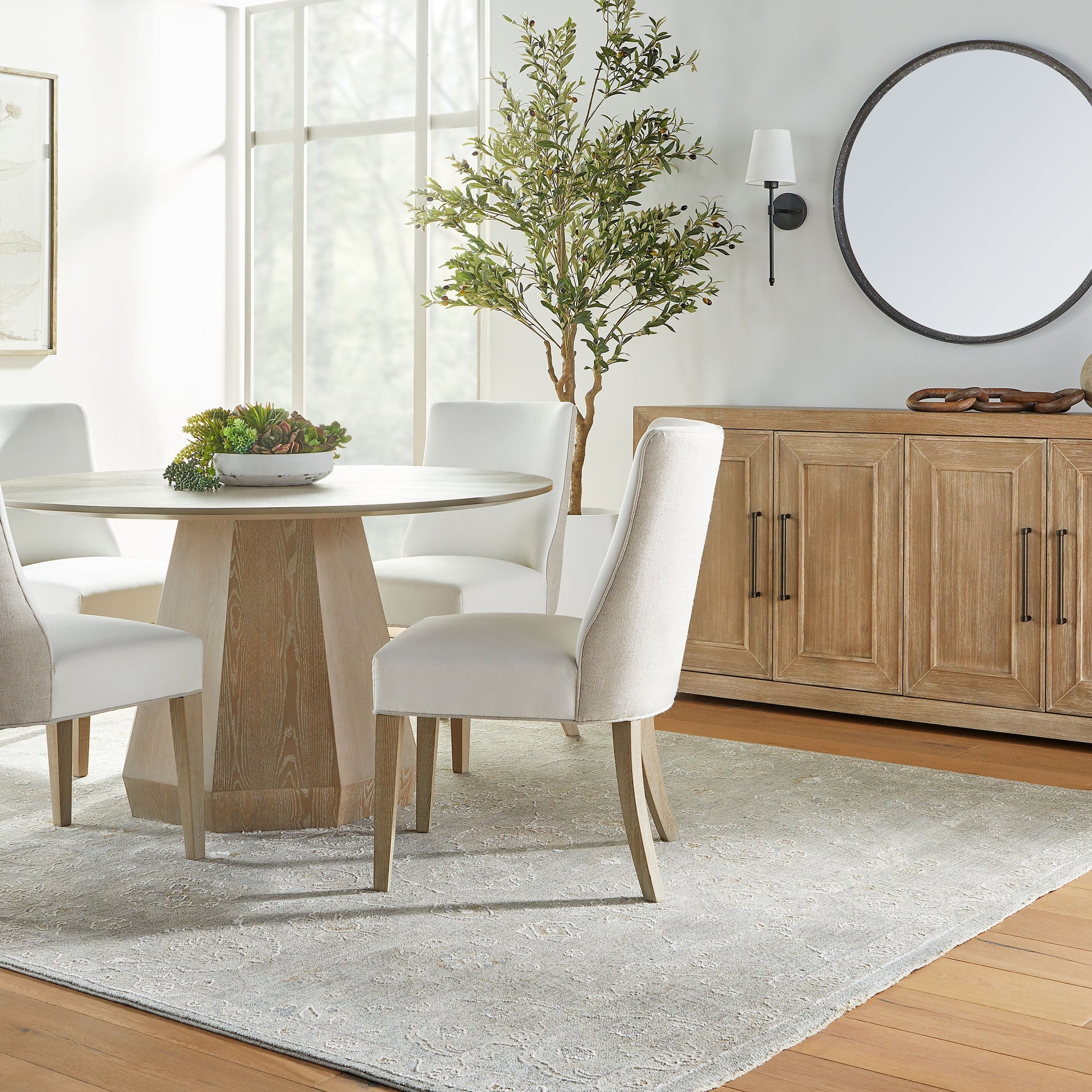 Essentials For Living Coulter 54 inch round dining table in natural gray ash wood with octagon pedestal base.