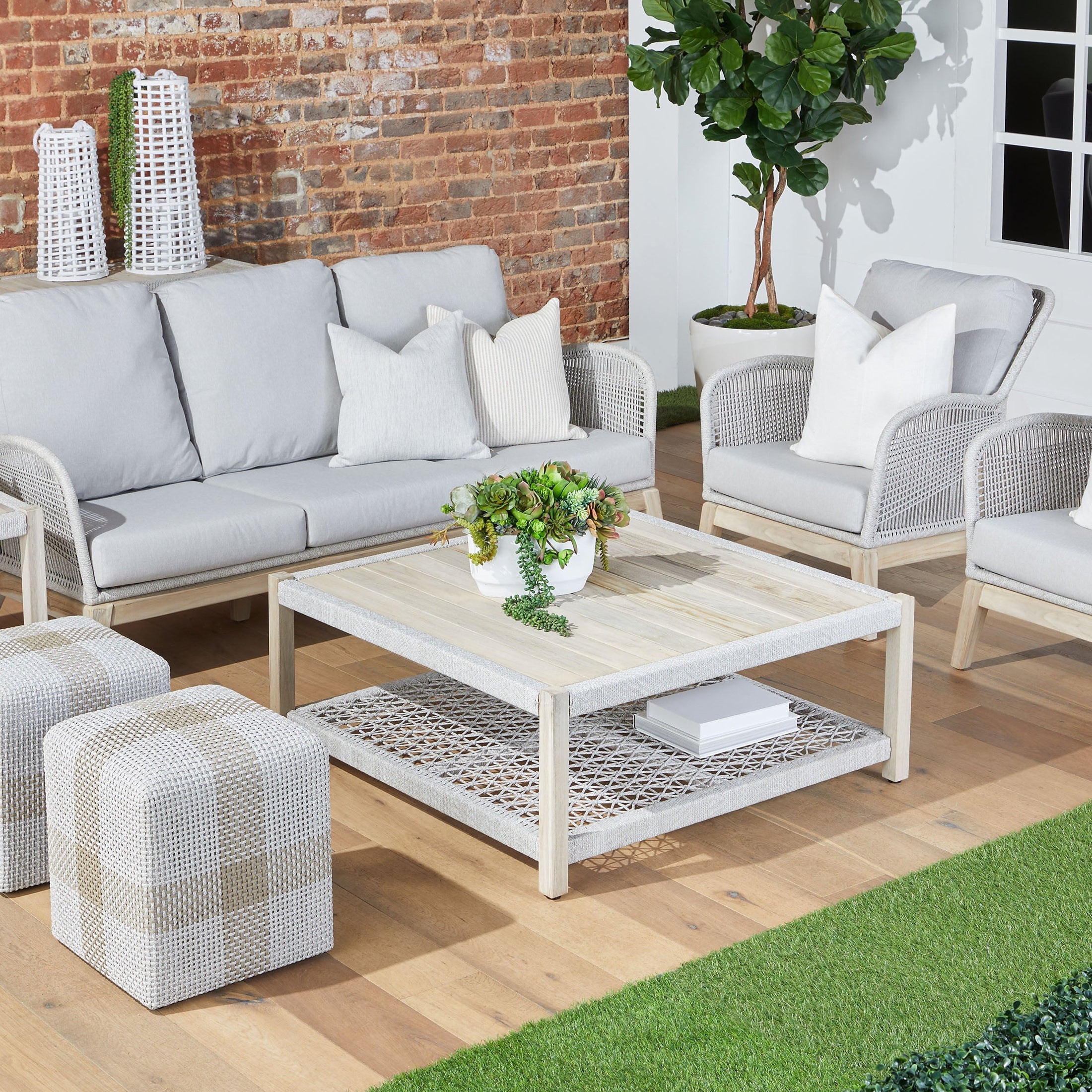 Essentials For Living Cross Accent Cube with taupe and white rope weave in a stylish indoor outdoor seating area