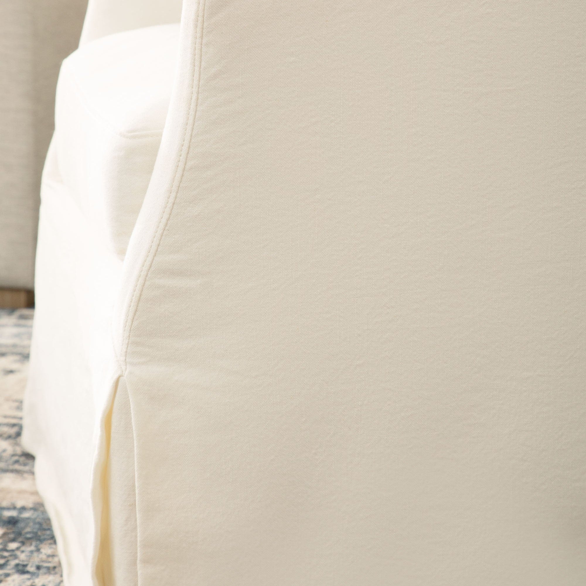 Close-up of the Crème Crepe cotton and linen slipcover on the Essentials for Living Faye swivel club chair