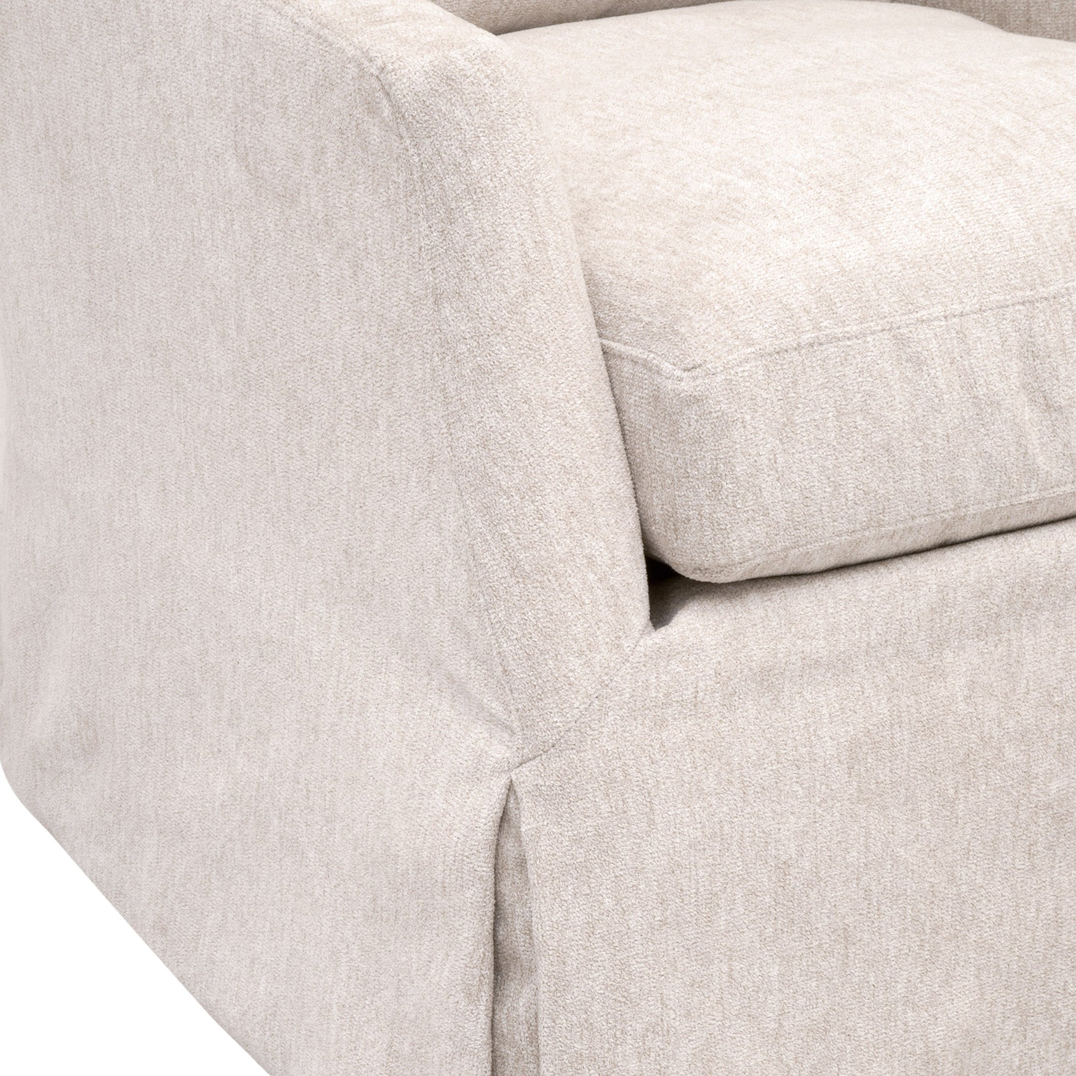 Close-up of the Faye Slipcover Swivel Club Chair’s soft Crème Crepe cotton and linen fabric with plush cushion detail