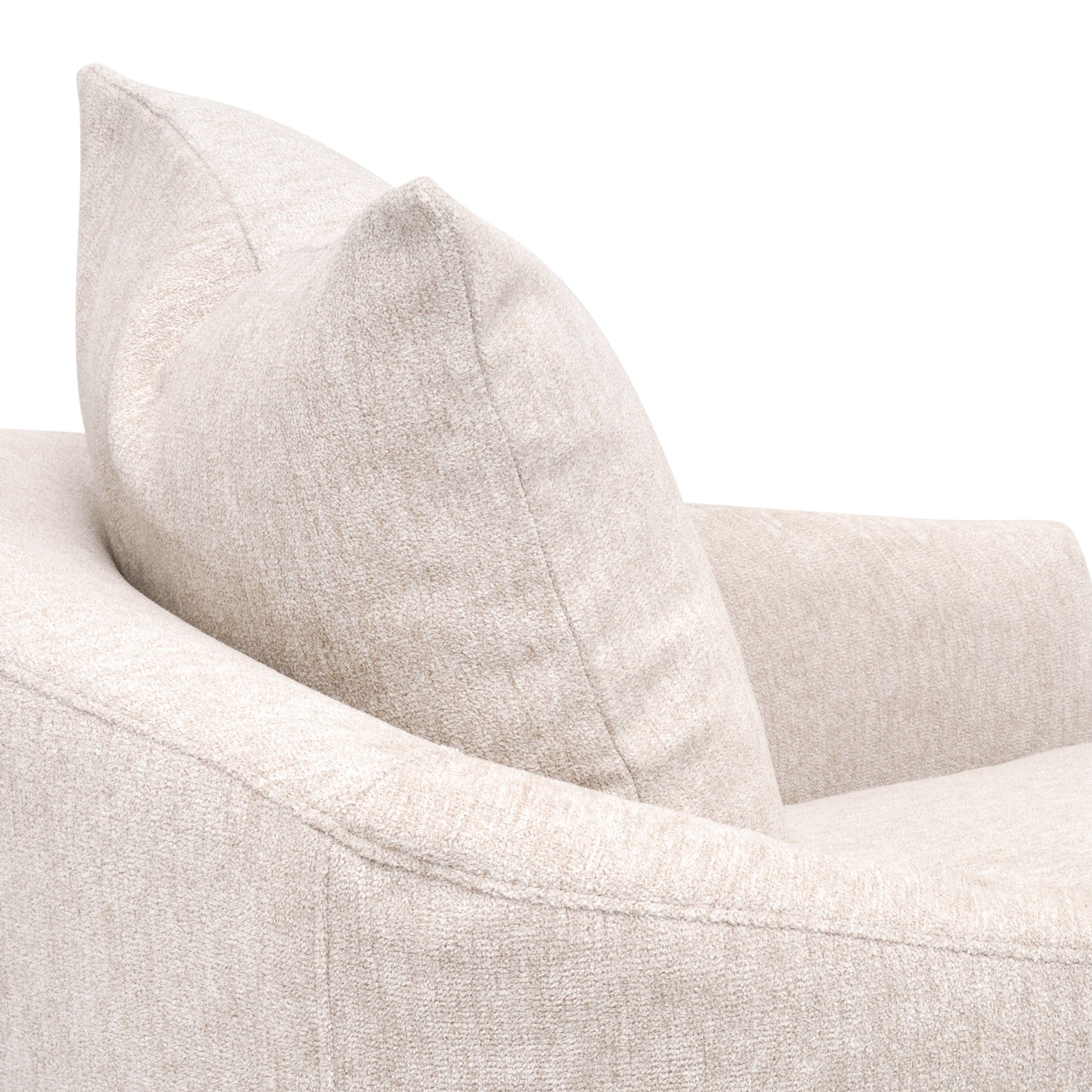 Close-up of beige slipcover fabric and plush pillow on Essentials For Living Faye swivel club chair