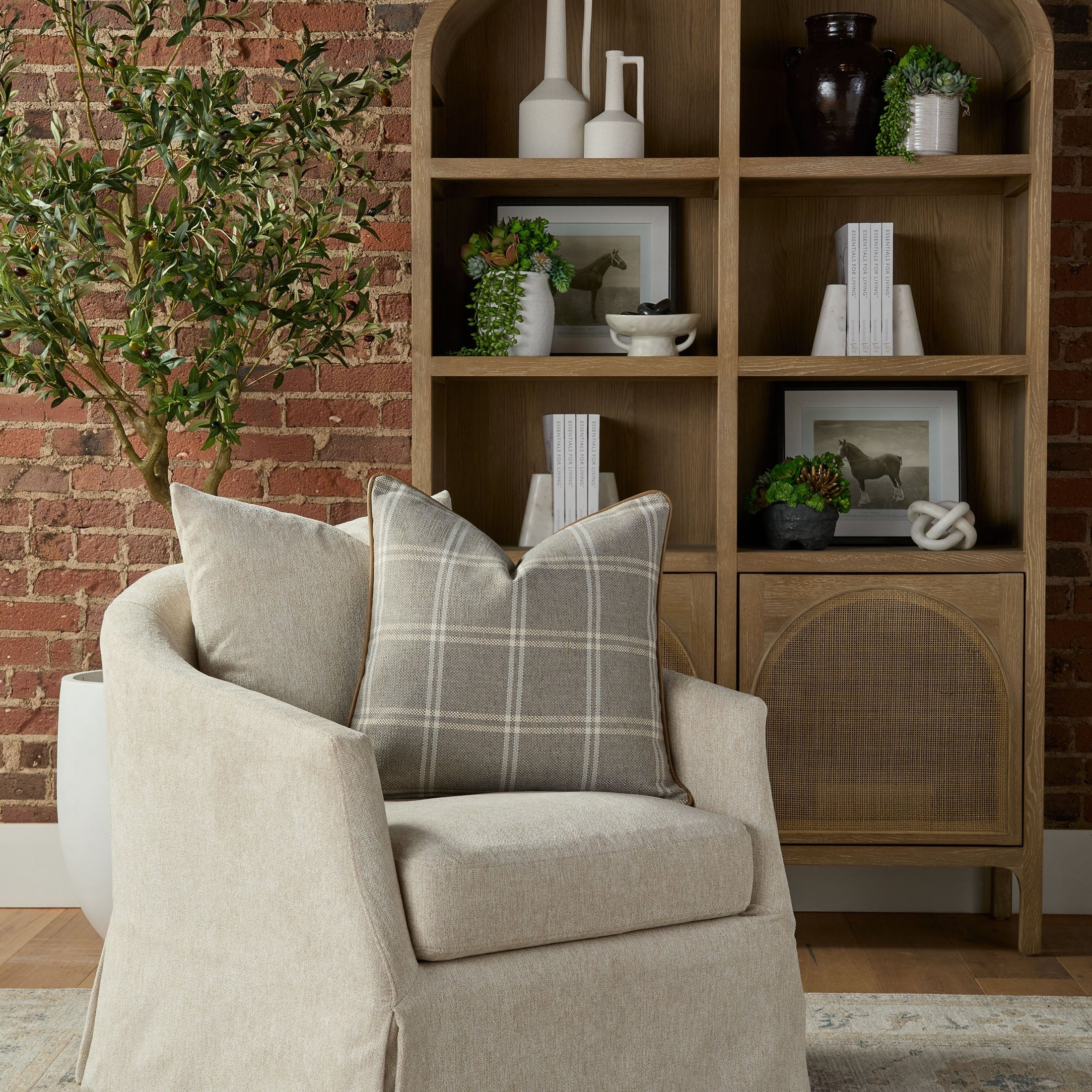 Essentials for Living Faye Slipcover Swivel Club Chair with cozy cushions in neutral tones in stylish living room setting