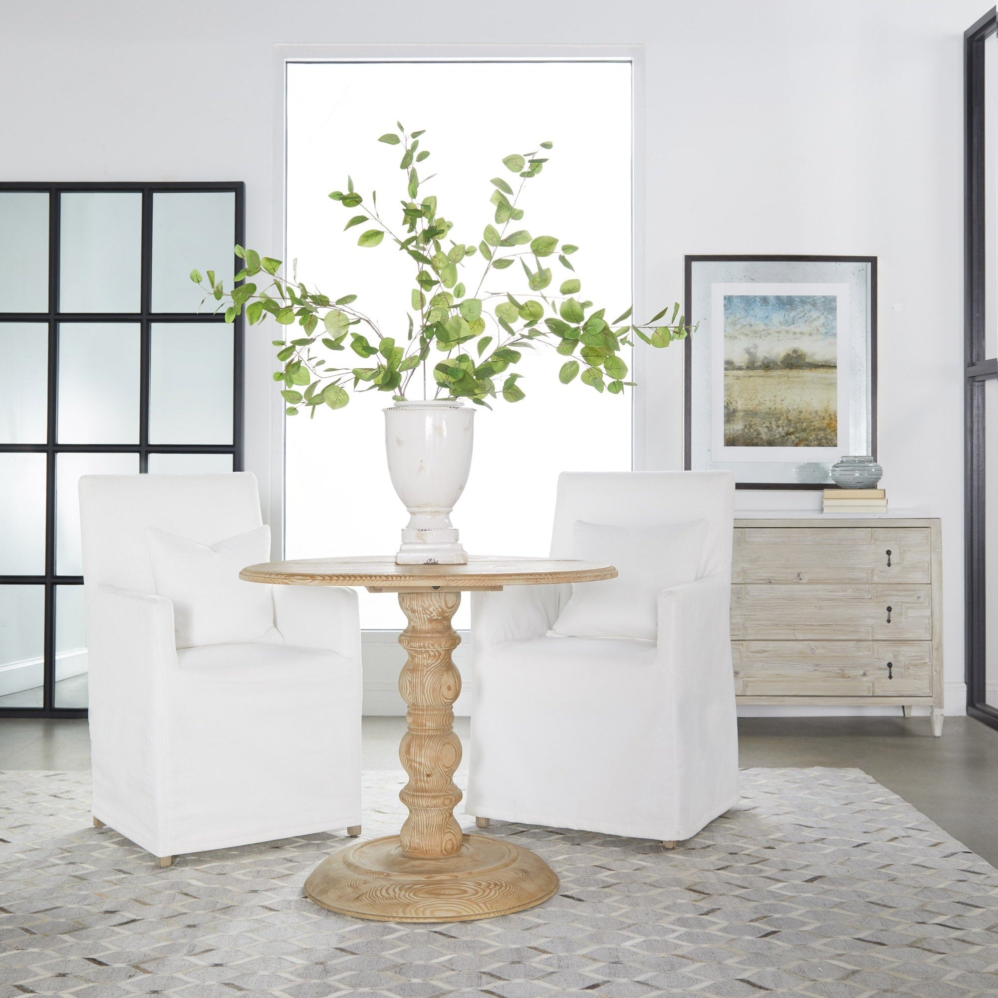 Grid Mirror with matte black oak frame and transitional grid design leaning in a modern living space by Essentials for Living.
