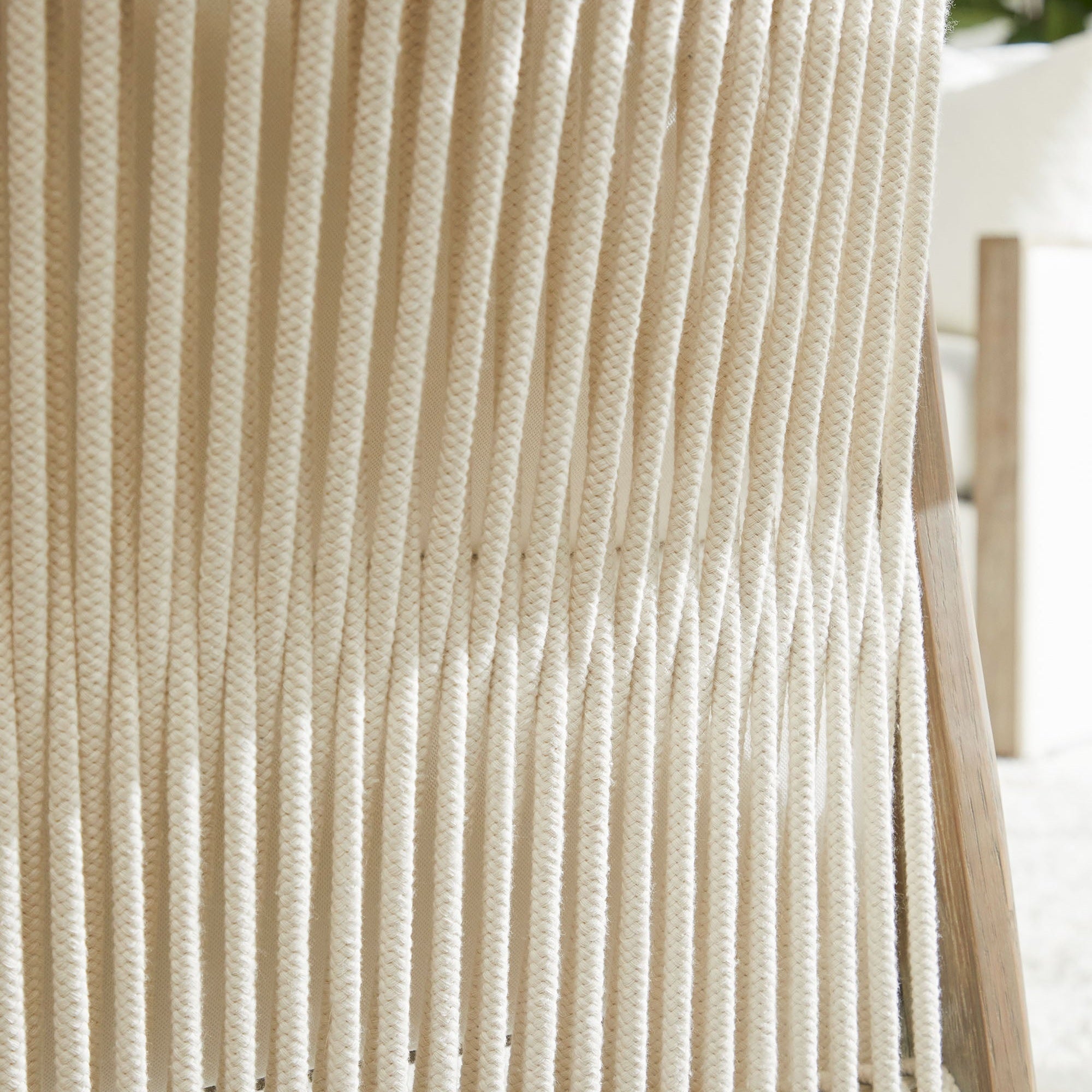 Close-up of white rope weave detailing on the Harbor Club Chair by Essentials For Living with a smoke-gray oak frame