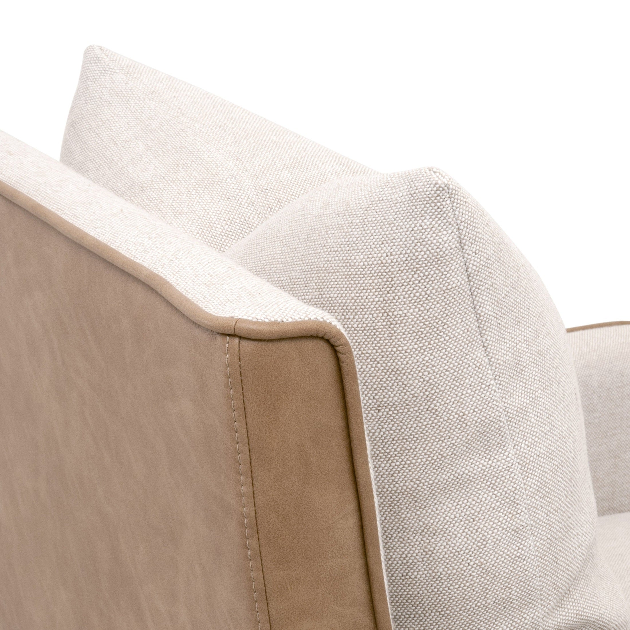 Close-up of Harmony Arm Chair showing two-tone fabric with contrasting edge piping and plush down throw pillow detail