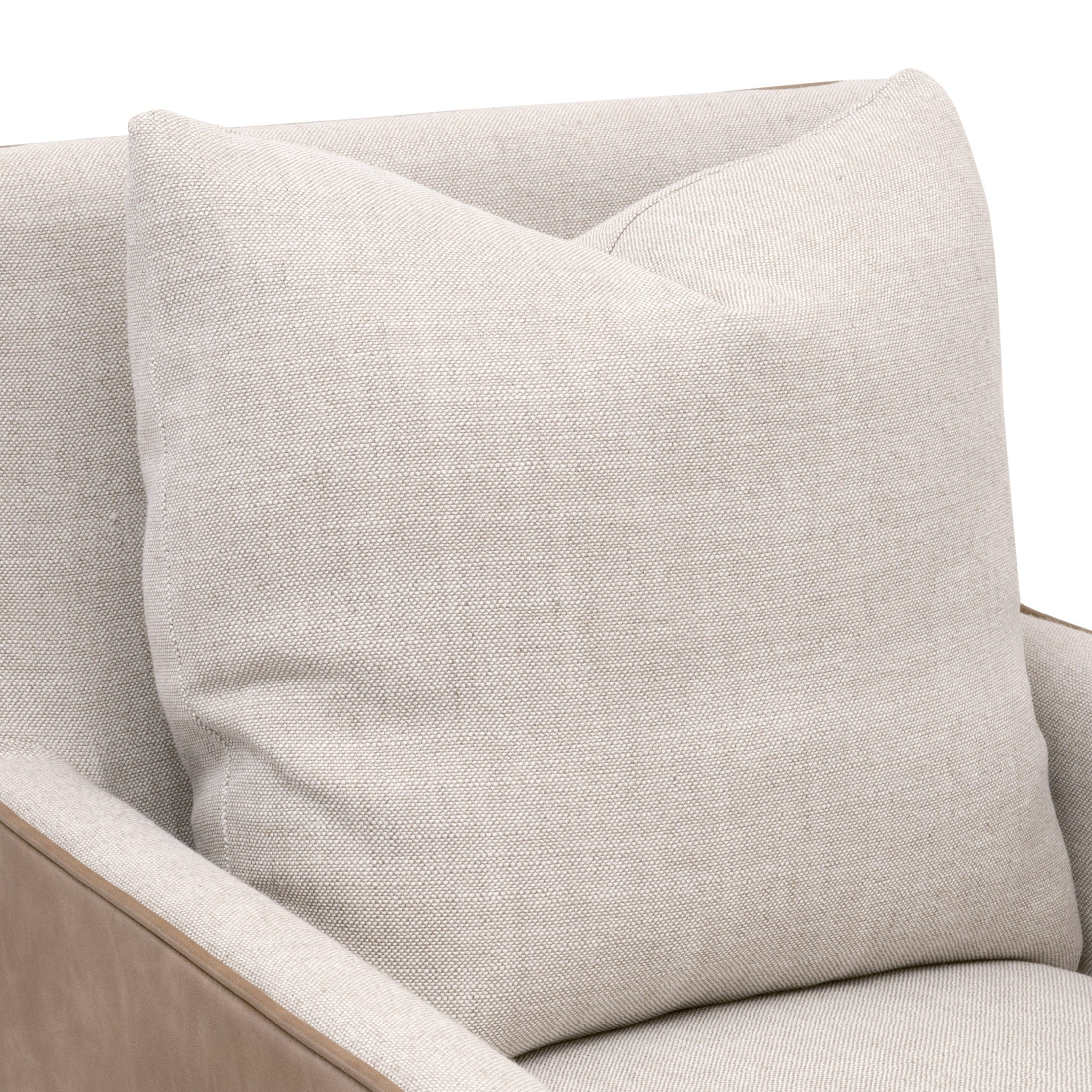Close-up of plush down throw pillow on Essentials for Living Harmony Arm Chair with casters in bisque fabric