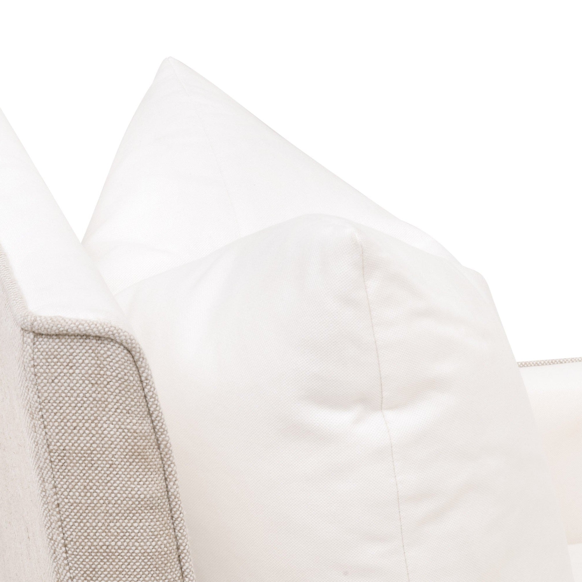 Close-up of the Harmony Arm Chair with soft white down throw pillow and bisque fabric upholstery edge by Essentials For Living