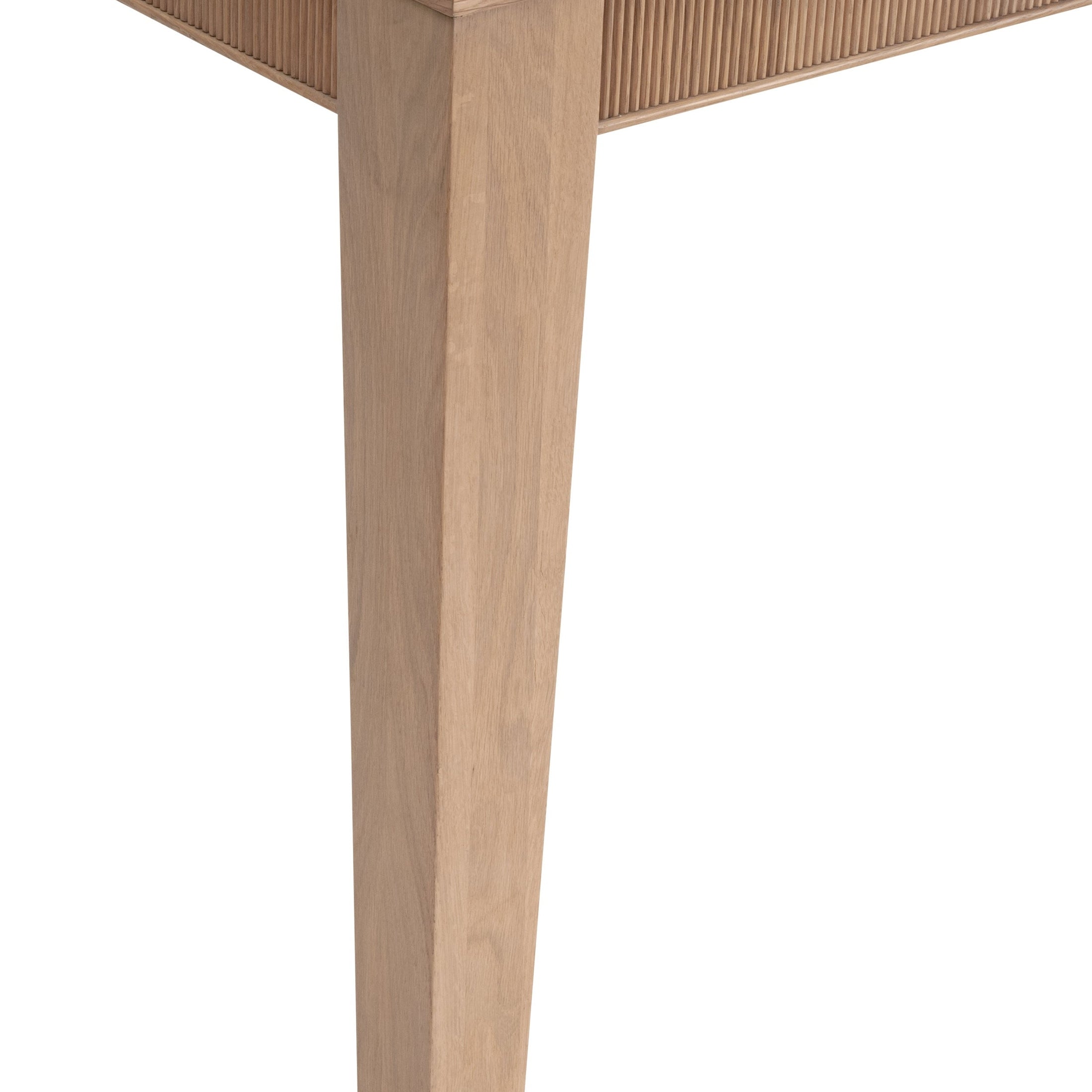 Close-up of natural oak leg and fluted apron detail on Highland Extension Dining Table by Essentials for Living