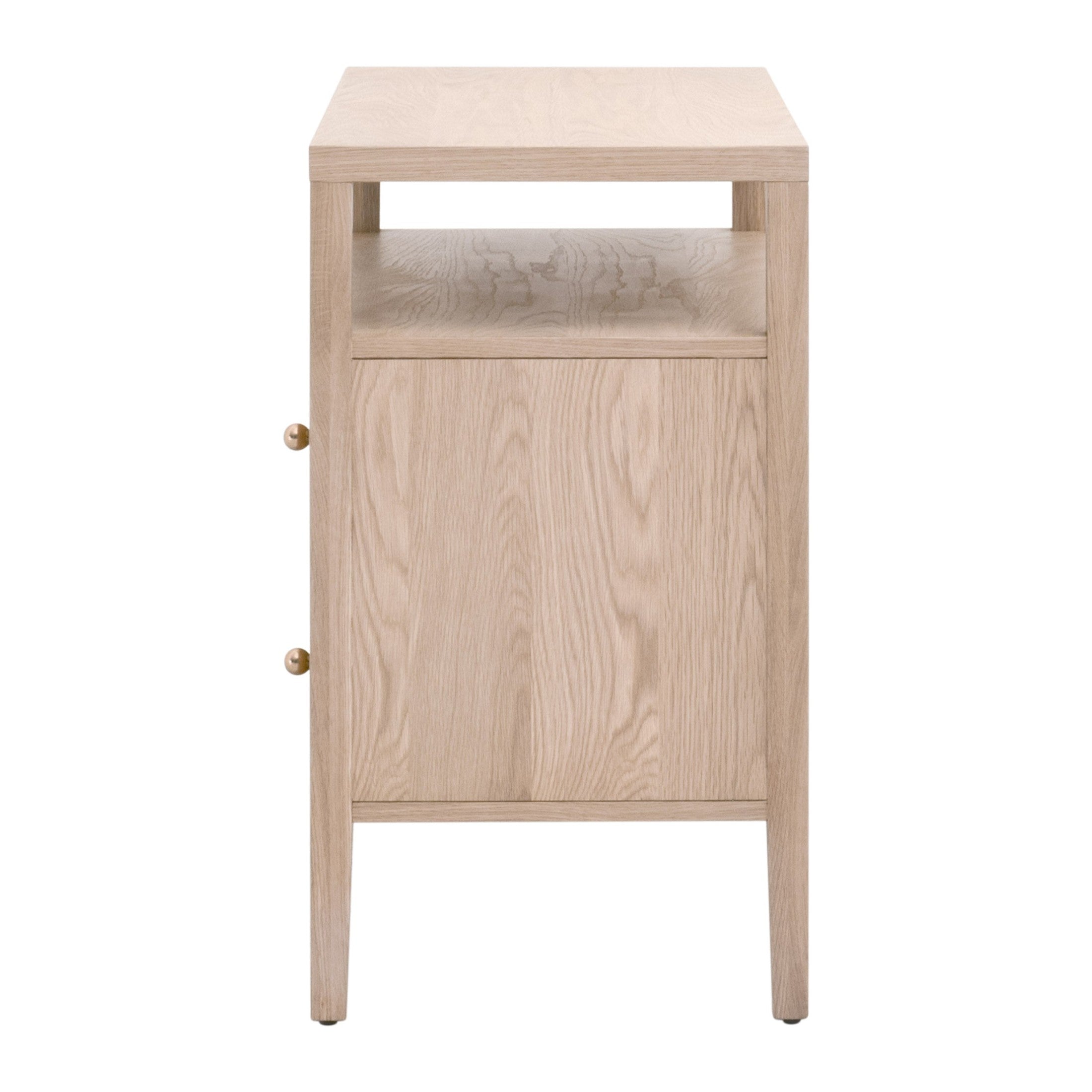Side view of a light oak wood nightstand with one open shelf and two drawers featuring brass knobs