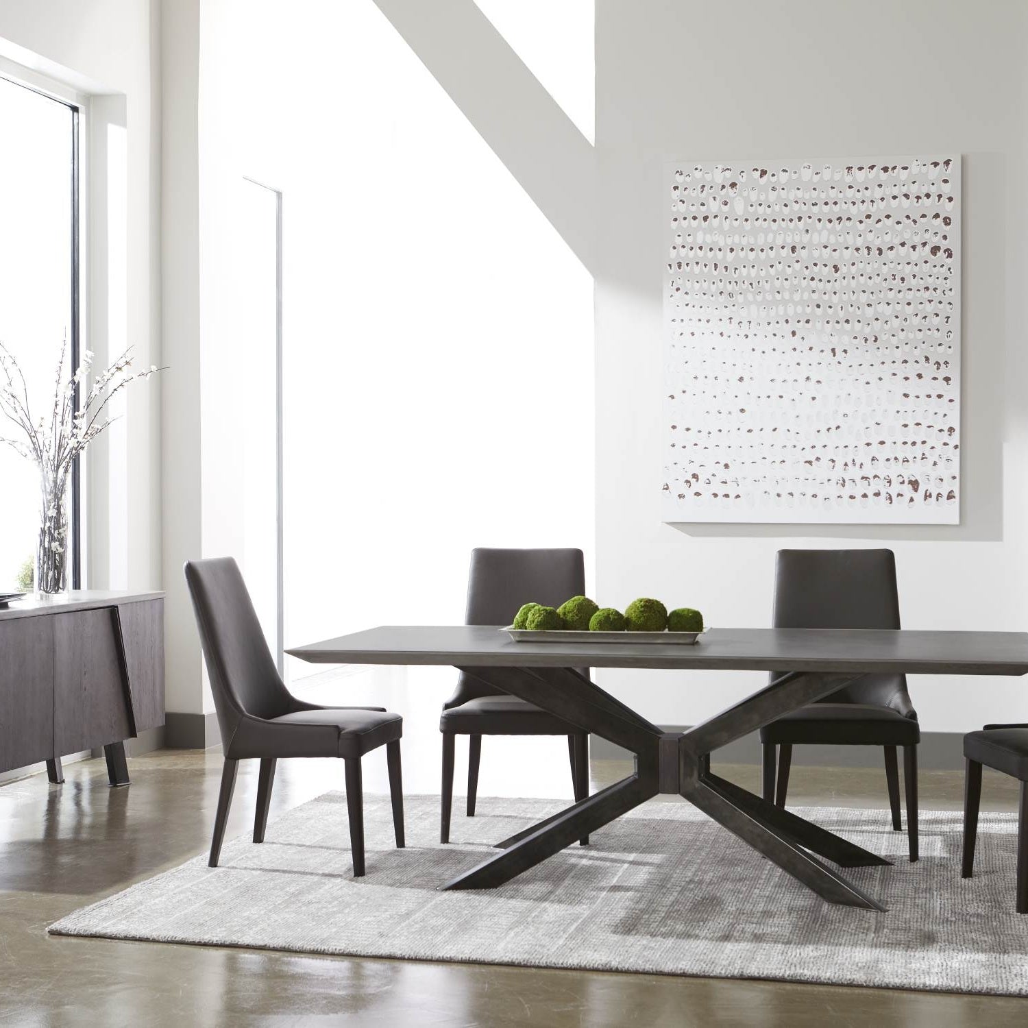 Industry Rectangle Dining Table with ash gray concrete top and black iron base in a modern dining room setting