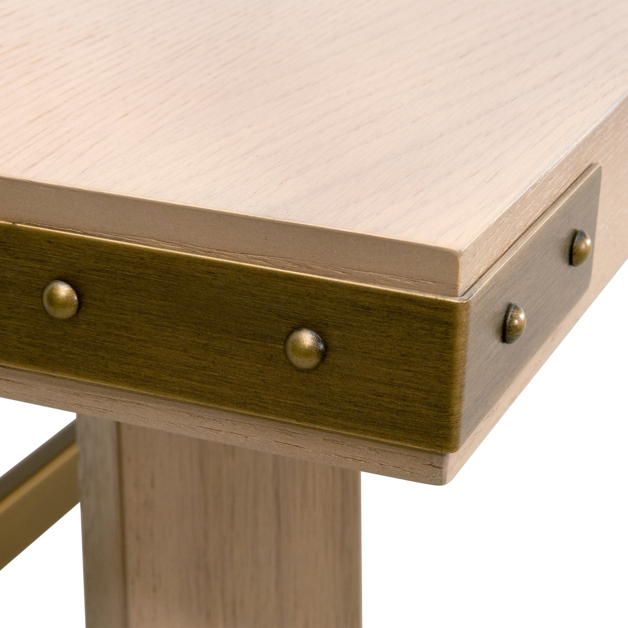 Close-up of Klein Dining Table corner with light honey oak veneer top and brushed gold metal brackets by Essentials For Living
