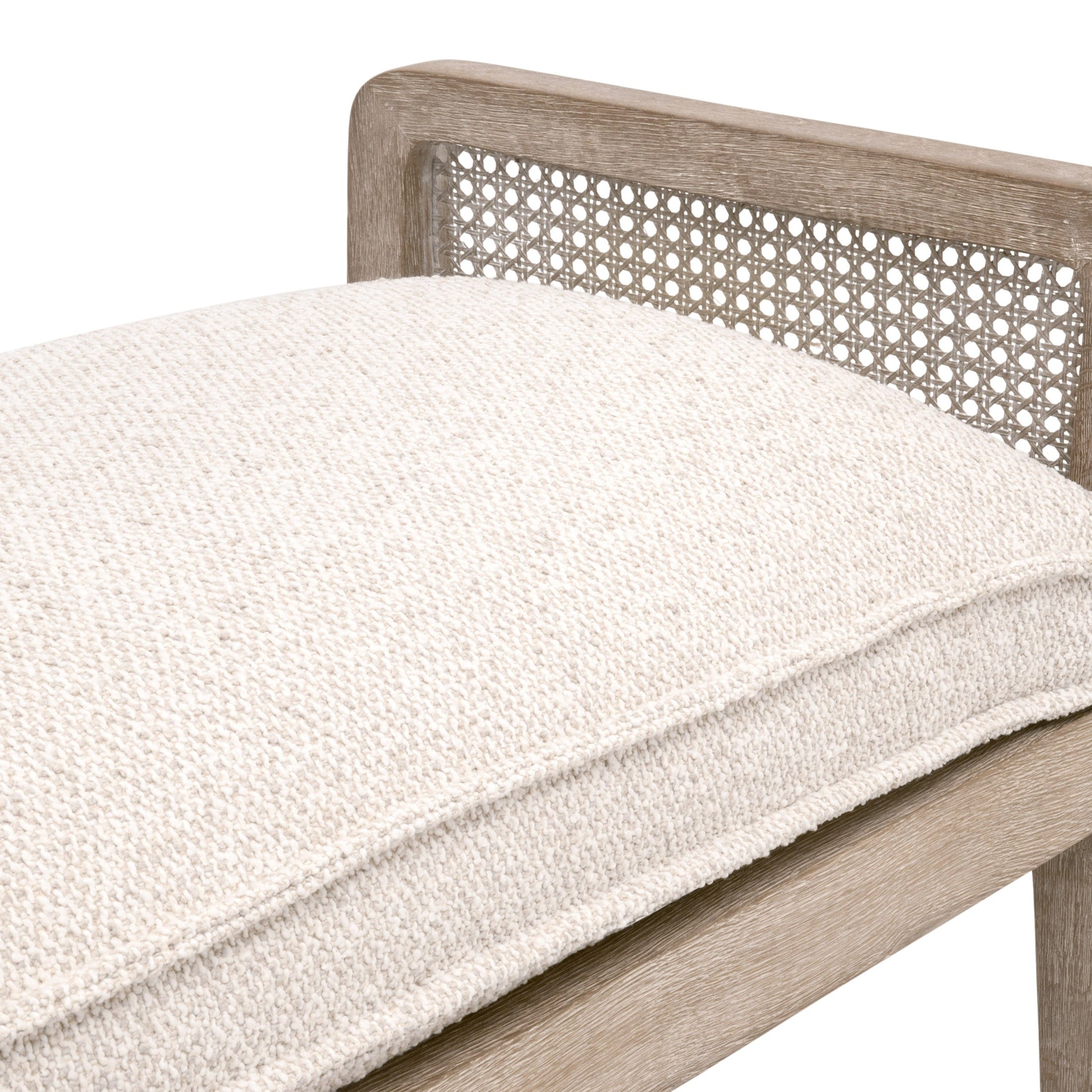 Close-up of Leone Bench showing natural gray oak frame and textured white cushion on cane seat back and arms