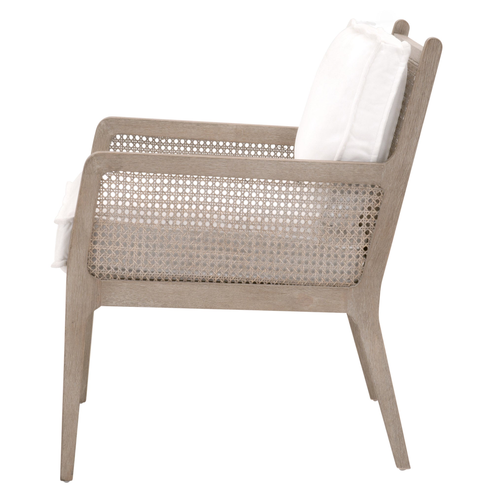 Side view of a gray oak framed club chair with handwoven cane sides and white cushions by Essentials for Living