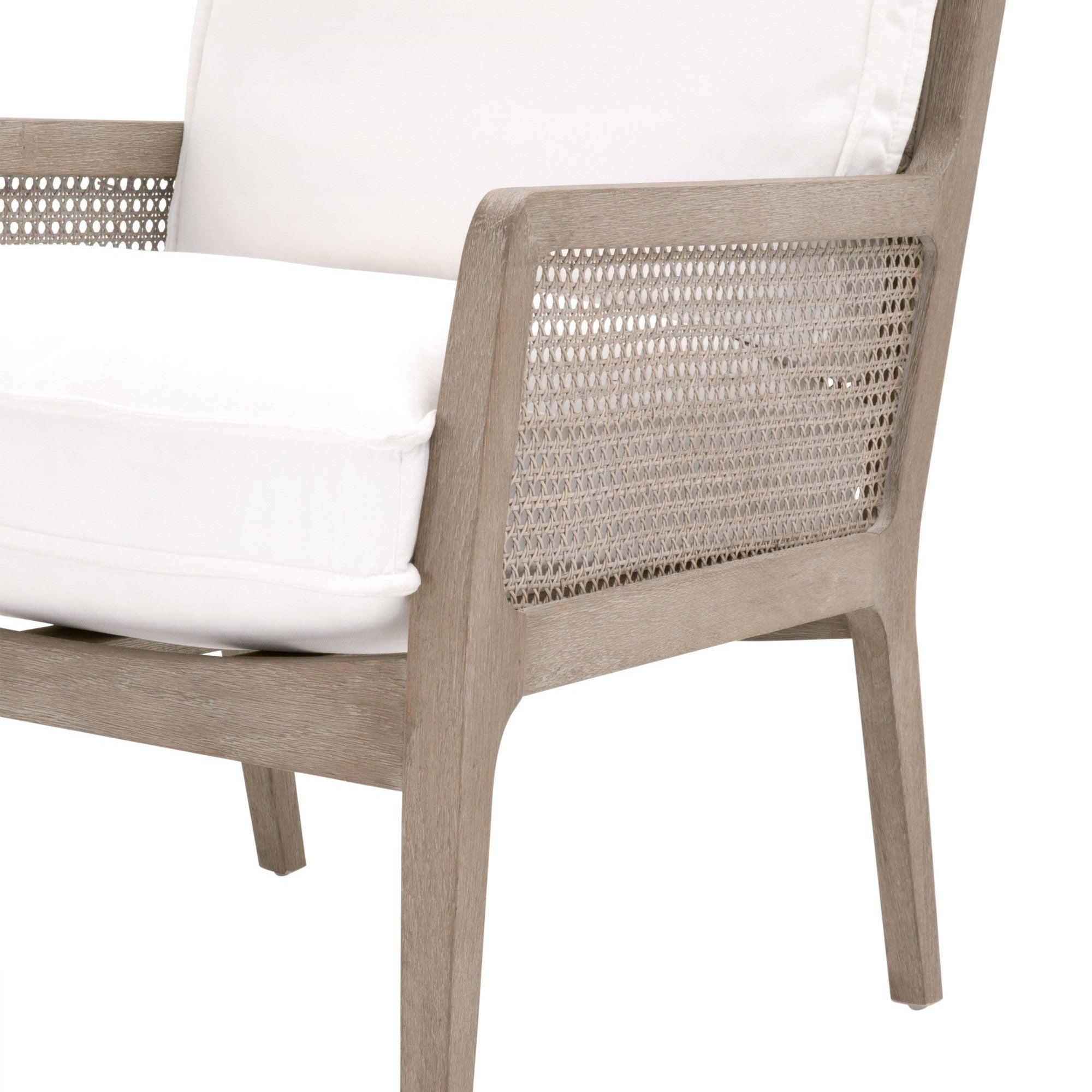Close-up of Essentials For Living Leone Club Chair featuring natural gray oak frame and handwoven cane armrest with white cushion
