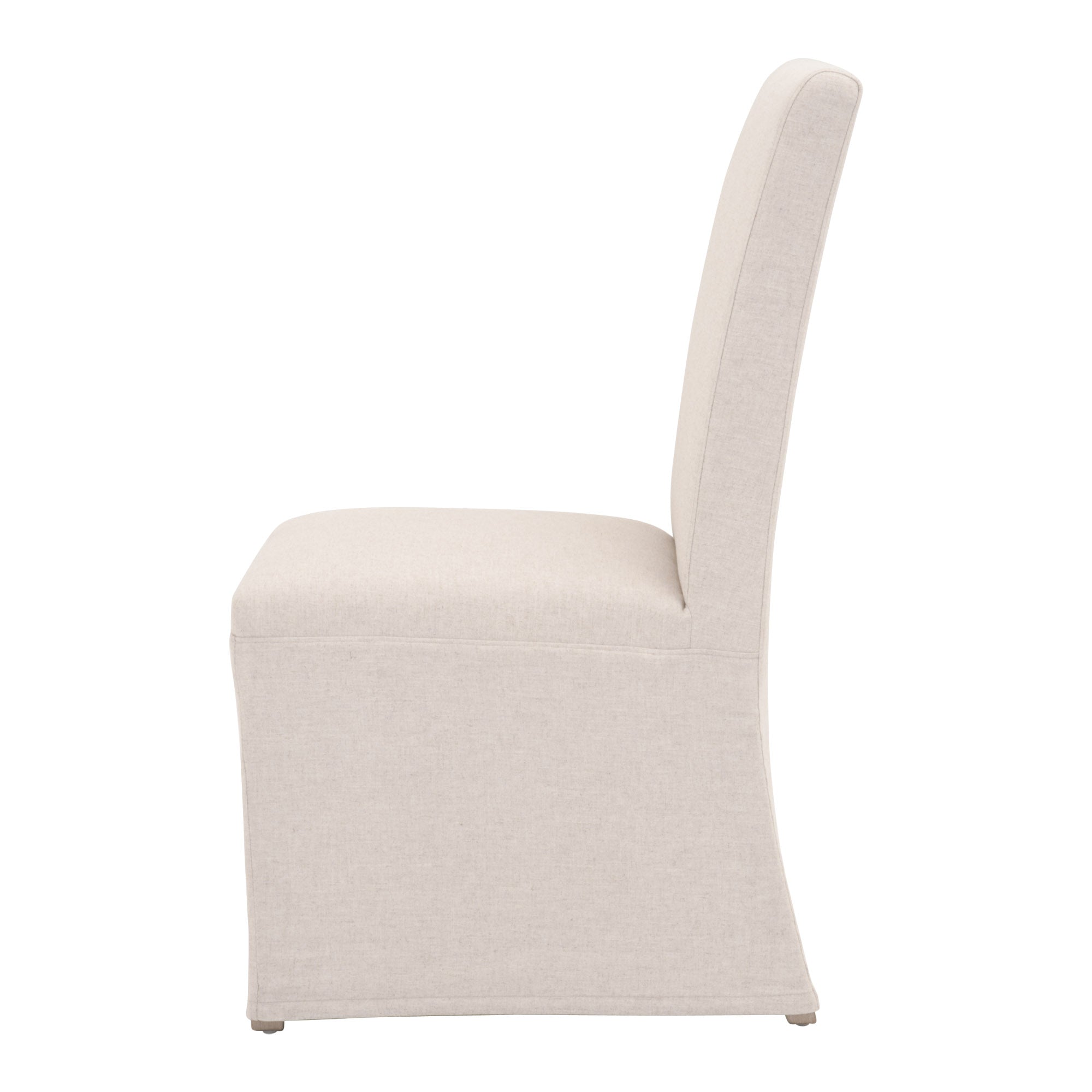 Side view of Levi Slipcover Dining Chair in neutral fabric with solid wood base by Essentials For Living