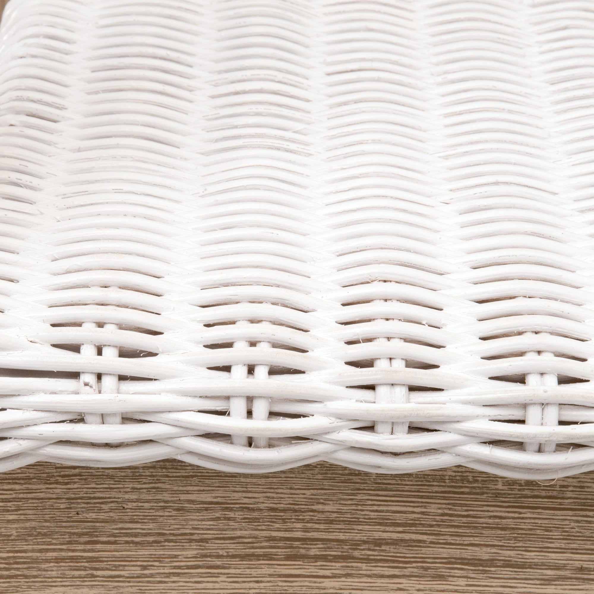 Close-up of white handwoven rattan seat detail on Lucia Counter Stool by Essentials for Living