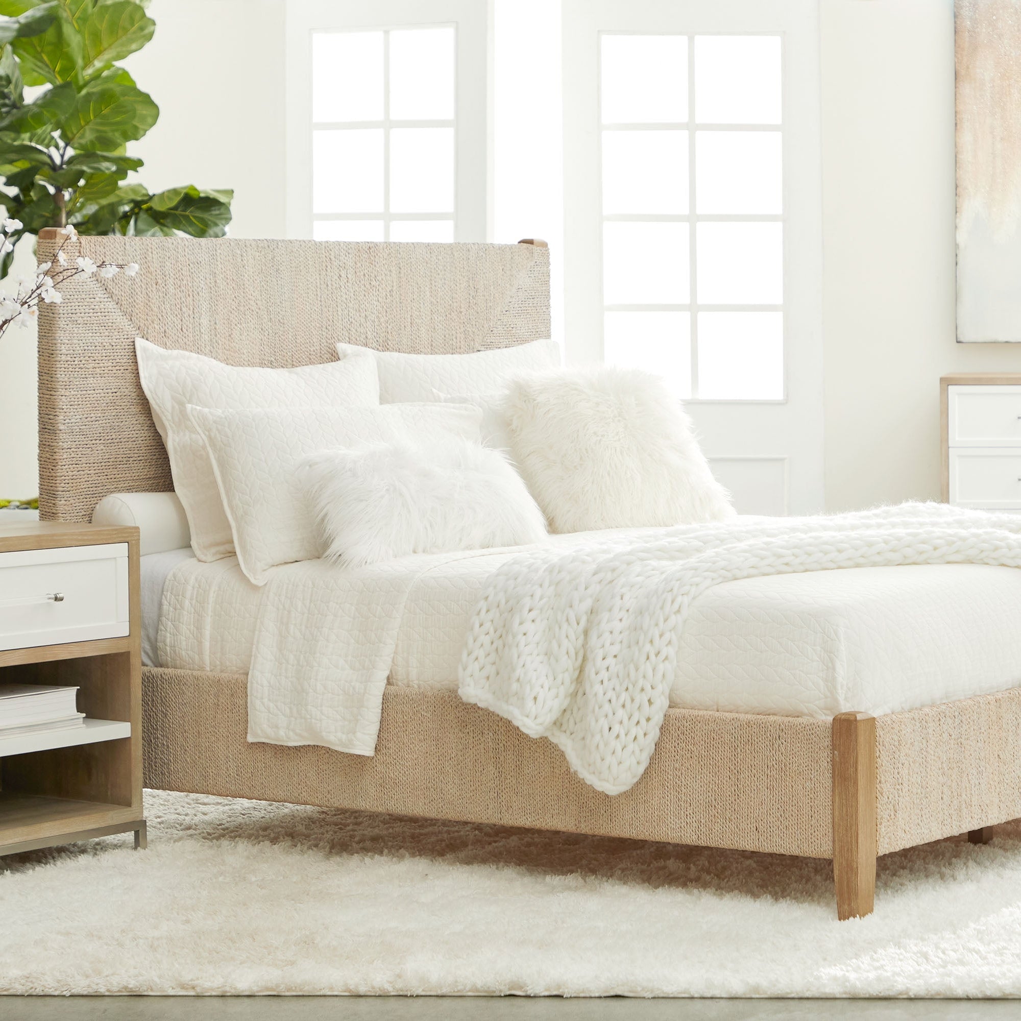 Malay Queen Bed with white-washed abaca rope and natural mahogany frame in a bright bedroom by Essentials For Living