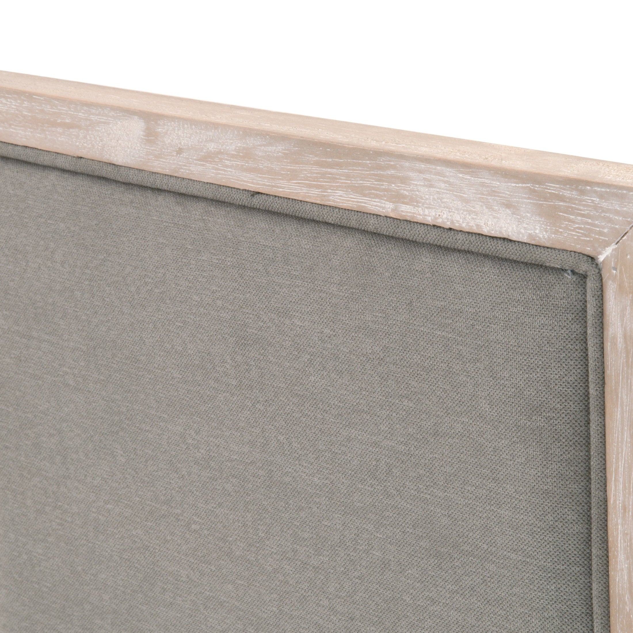 Close-up of Martin Dining Chair's gray LiveSmart Peyton fabric upholstery and natural gray rubberwood frame edge by Essentials For Living