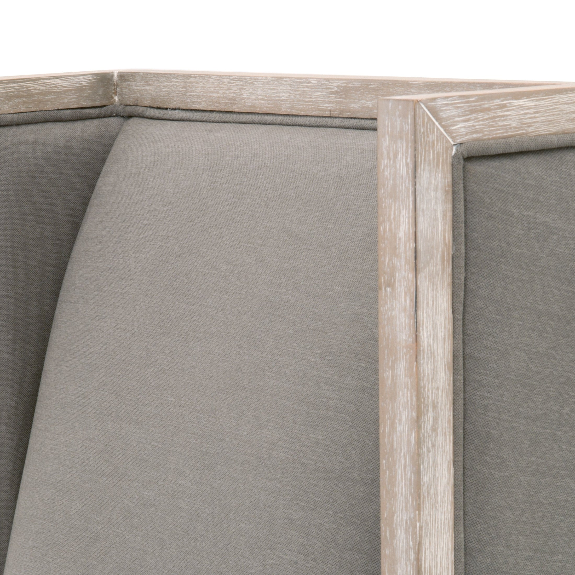 Close-up of Essentials For Living Martin Wing Chair fabric and natural gray solid rubberwood frame corner detail