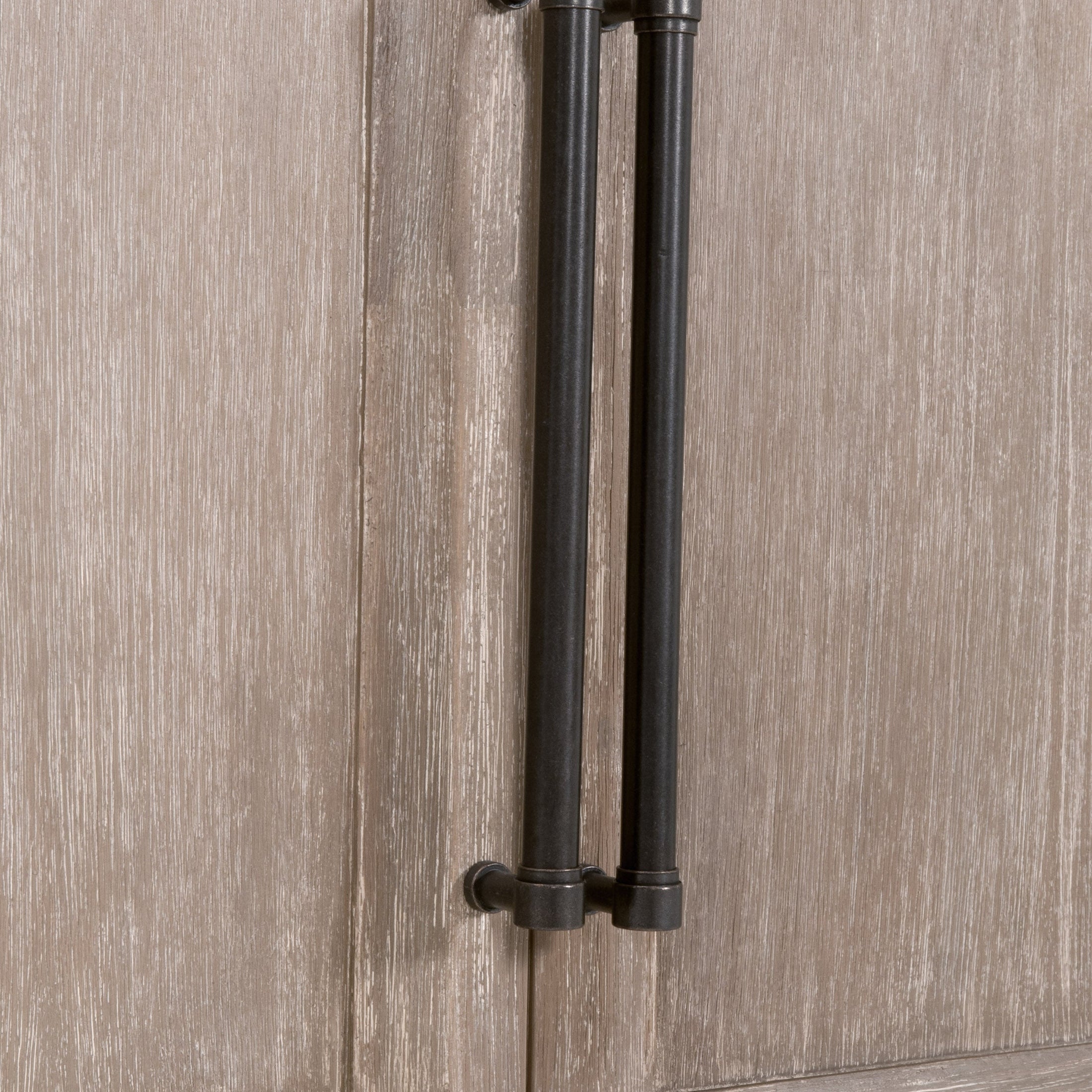 Close-up of natural gray acacia wood door with black metal handles on Morris Storage Bookcase by Essentials for Living