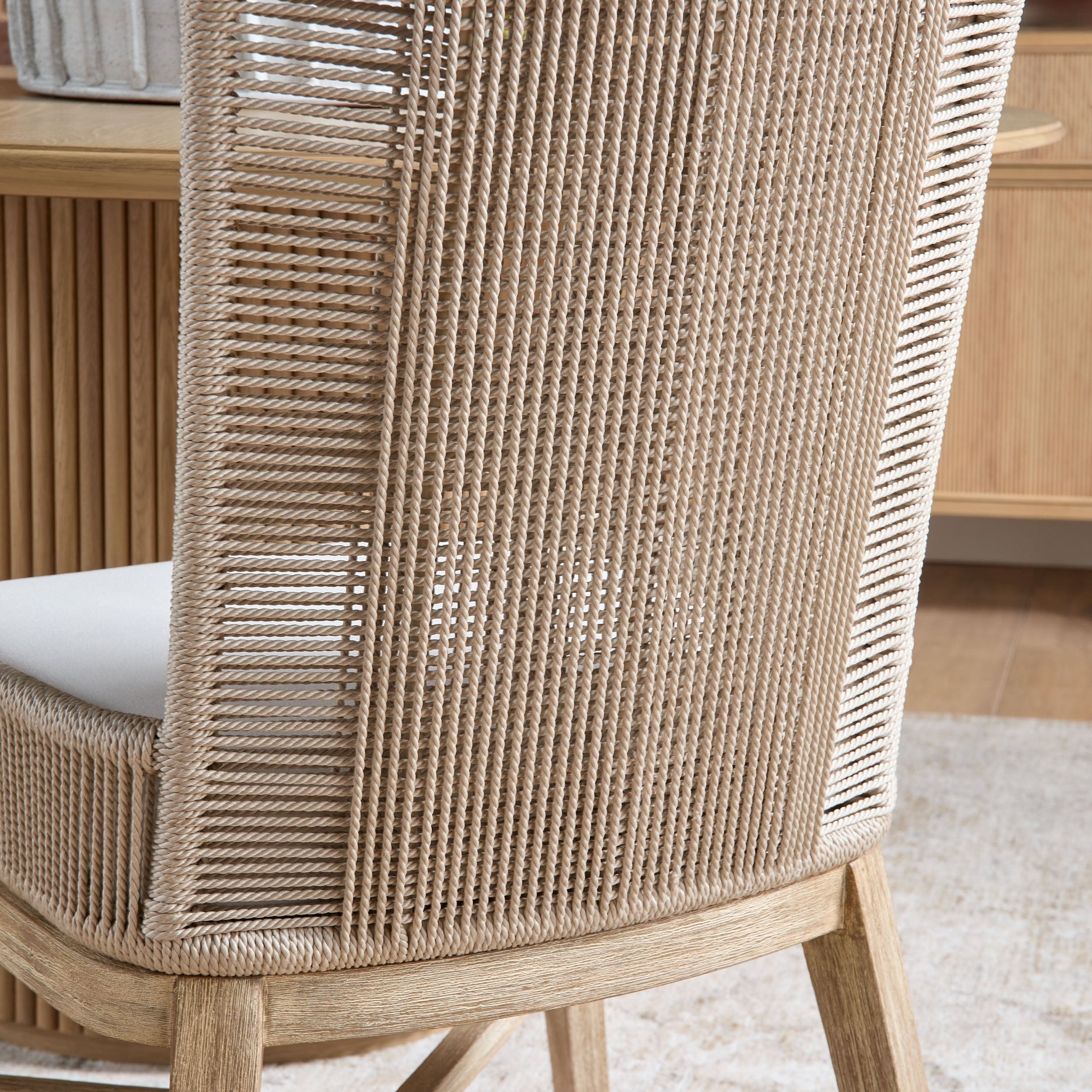 Close-up of Overlay Dining Chair backrest with handwoven oyster twist rope and natural gray mahogany frame by Essentials for Living